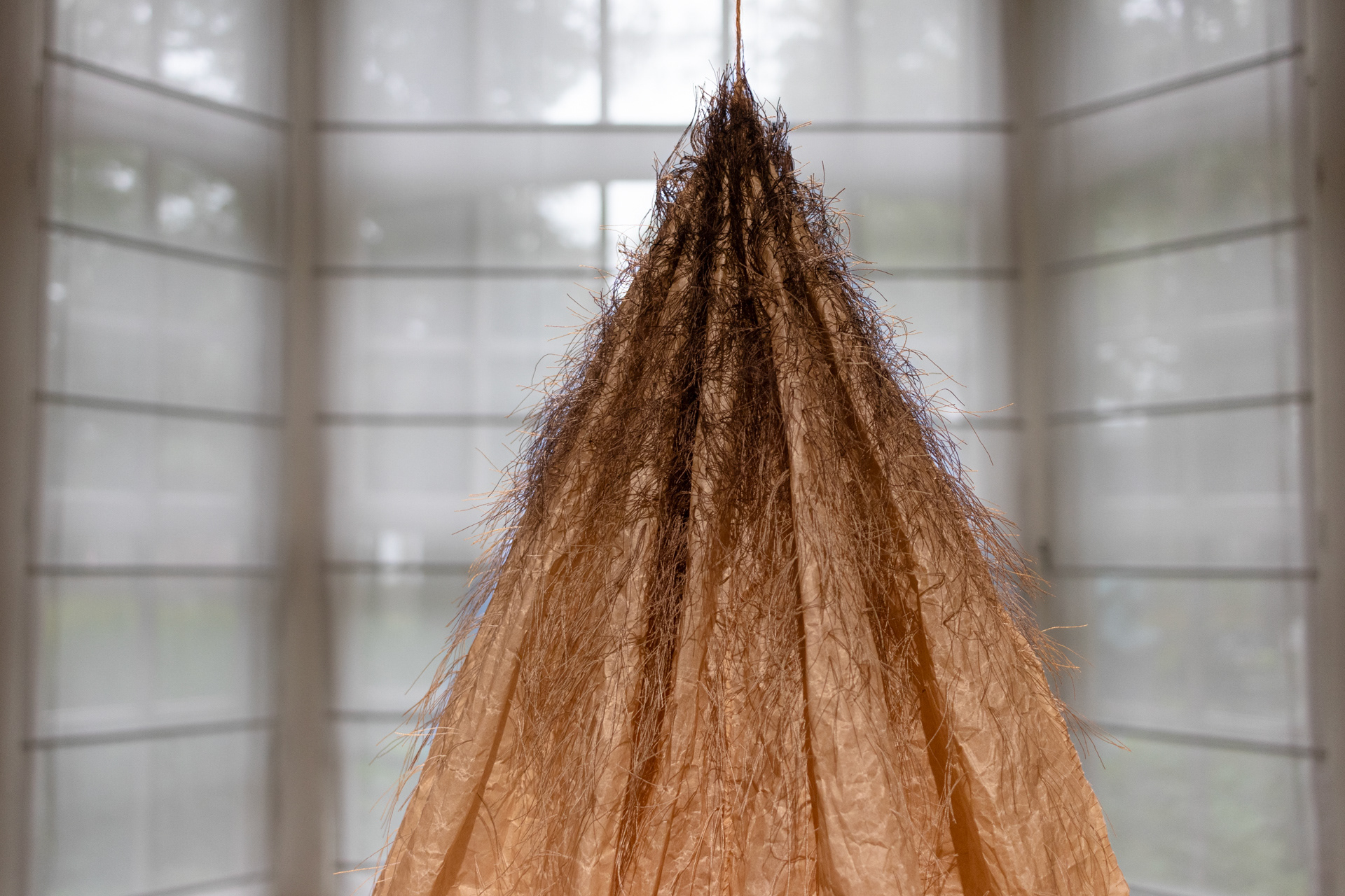 Untitled (from „Form beloved by life” - series) baking paper, threads approx.: 160x70x70cm, 2024
