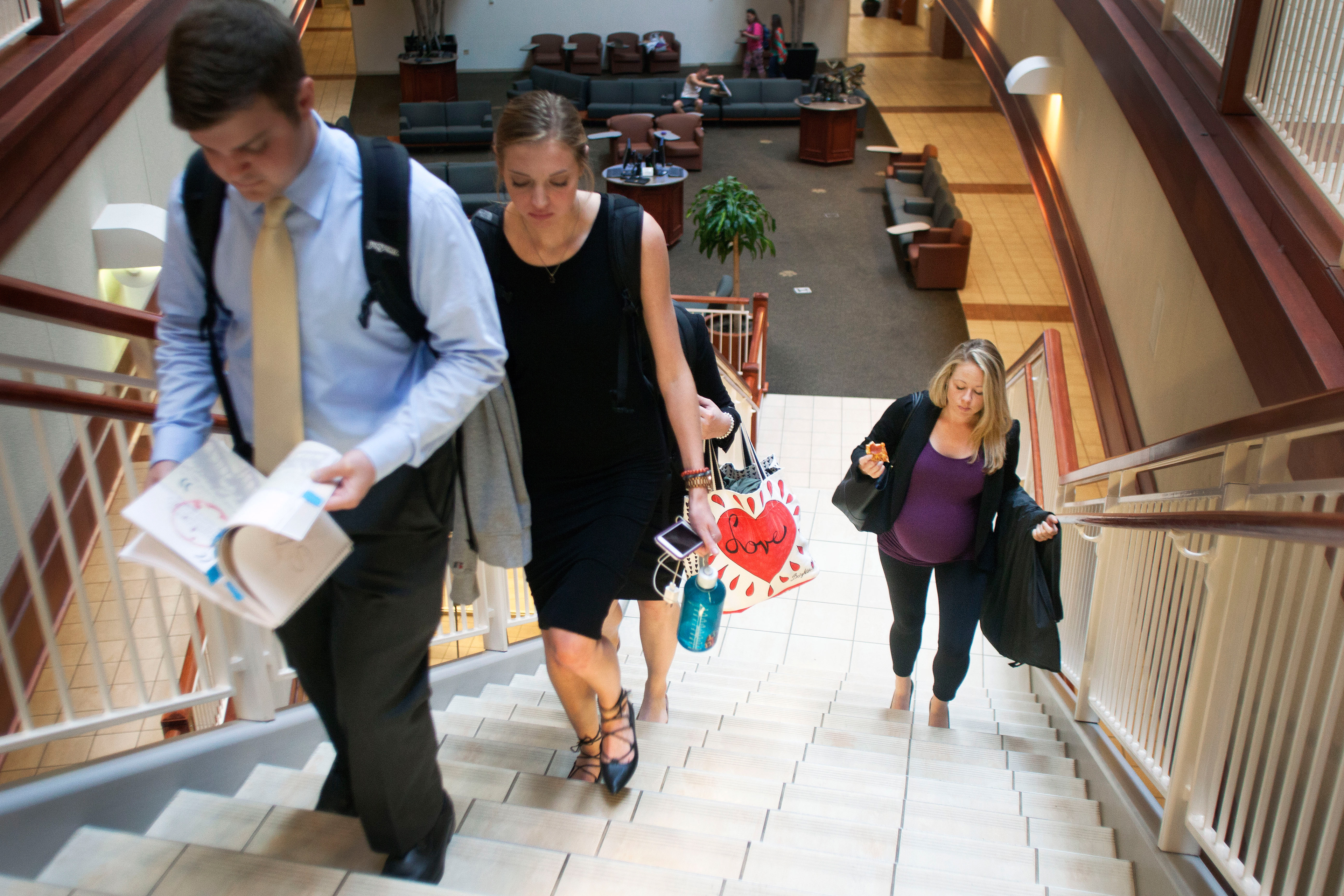 After practicing their capstone dress rehearsal presentation, Traci and her classmates walk up the steps of Cornell Hall on Thursday, April 28, 2016. Their group presented a marketing plan to the University Club on how to better serve their customers.