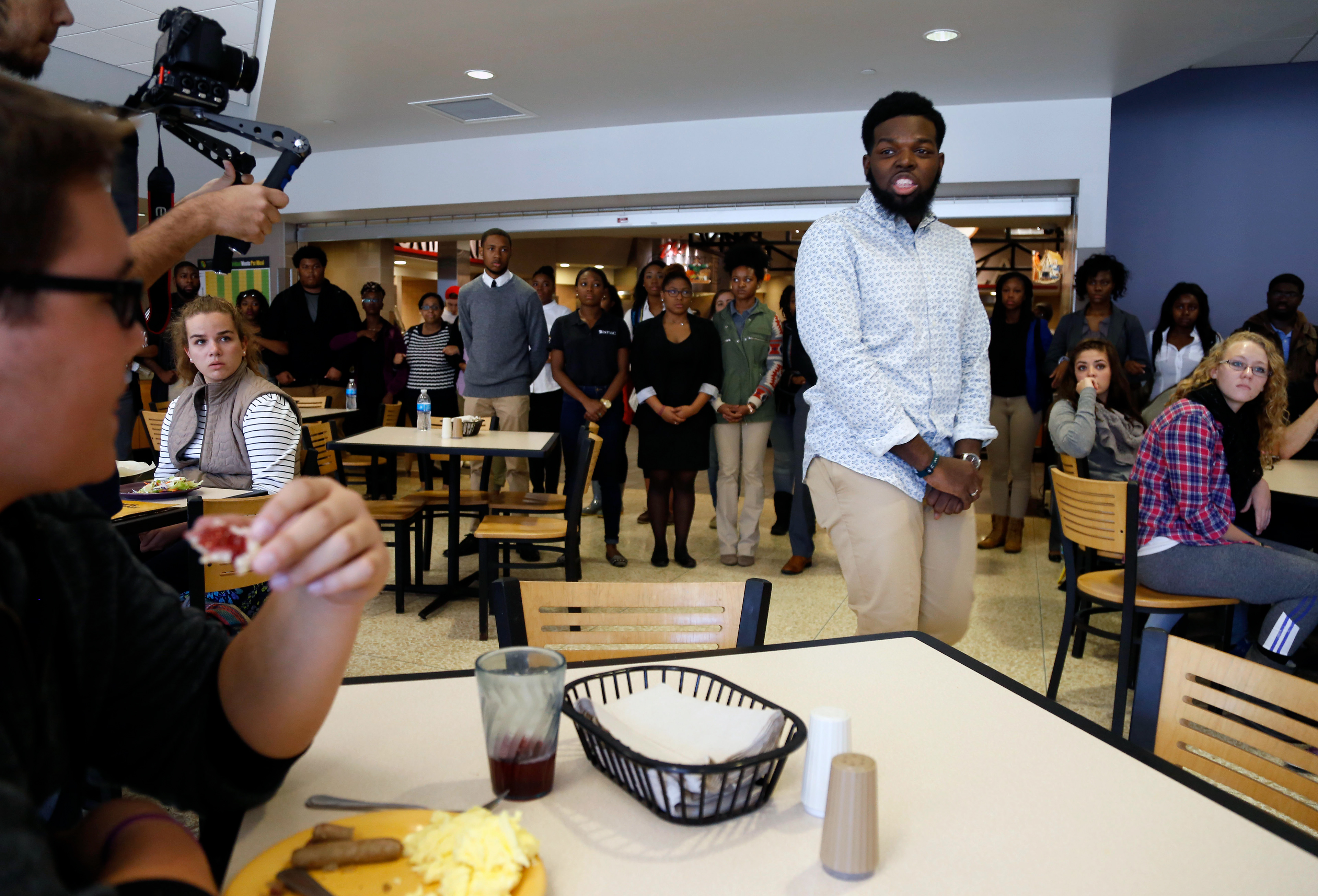 Curtis Taylor Jr. leads a demonstration at the Mark Twain Dining Hall during a protest Saturday, Nov. 7, 2015. Members of Concerned Student 1950 spoke of their testimony of racism on campus.