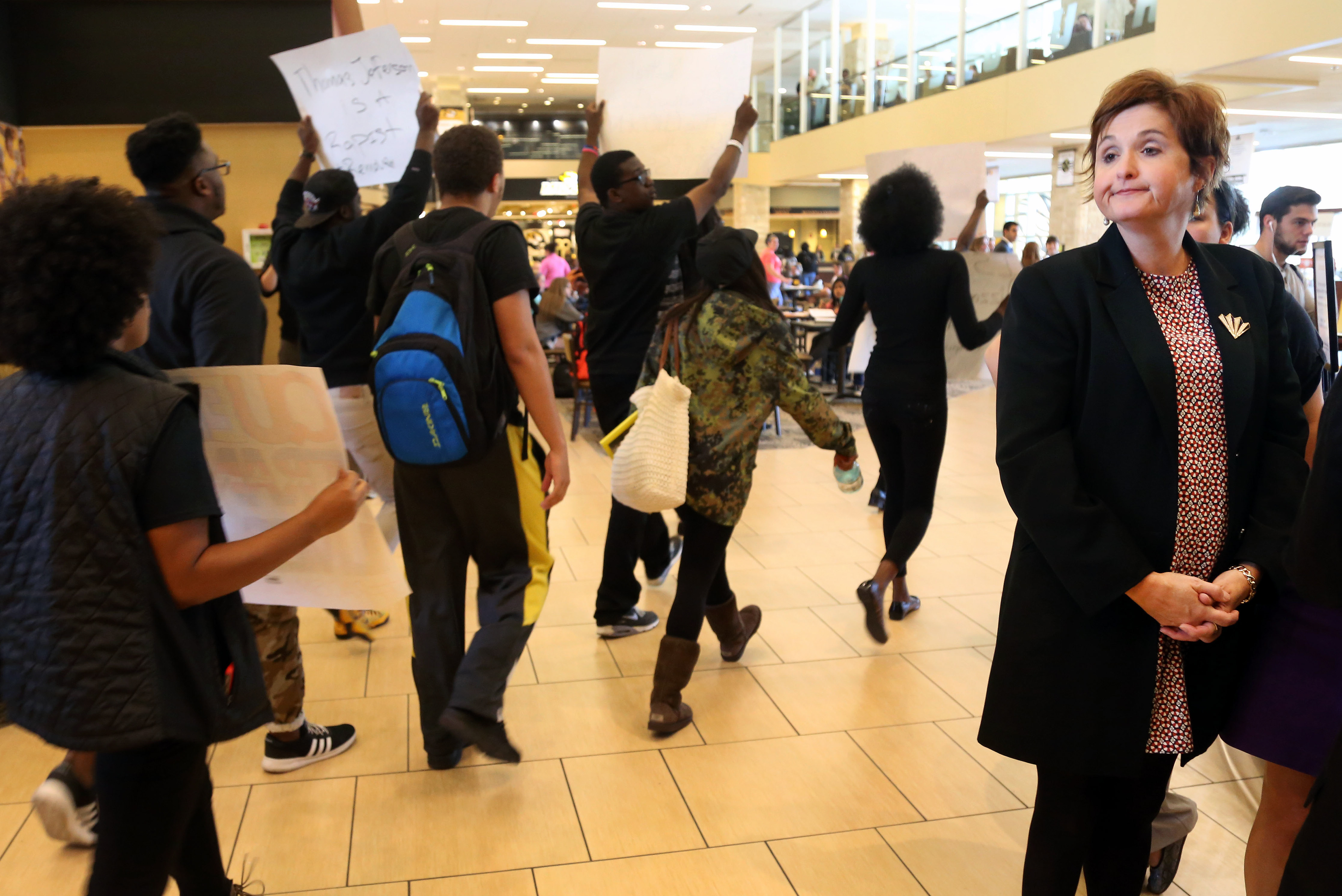 Sarah Bell/Missourian Students gather at MU's Student Center to protest the way the university has handled racism on campus Thursday, Oct. 1, 2015. About 40 students protested, carrying banners and shouting about justice and the racism they say they face everyday.