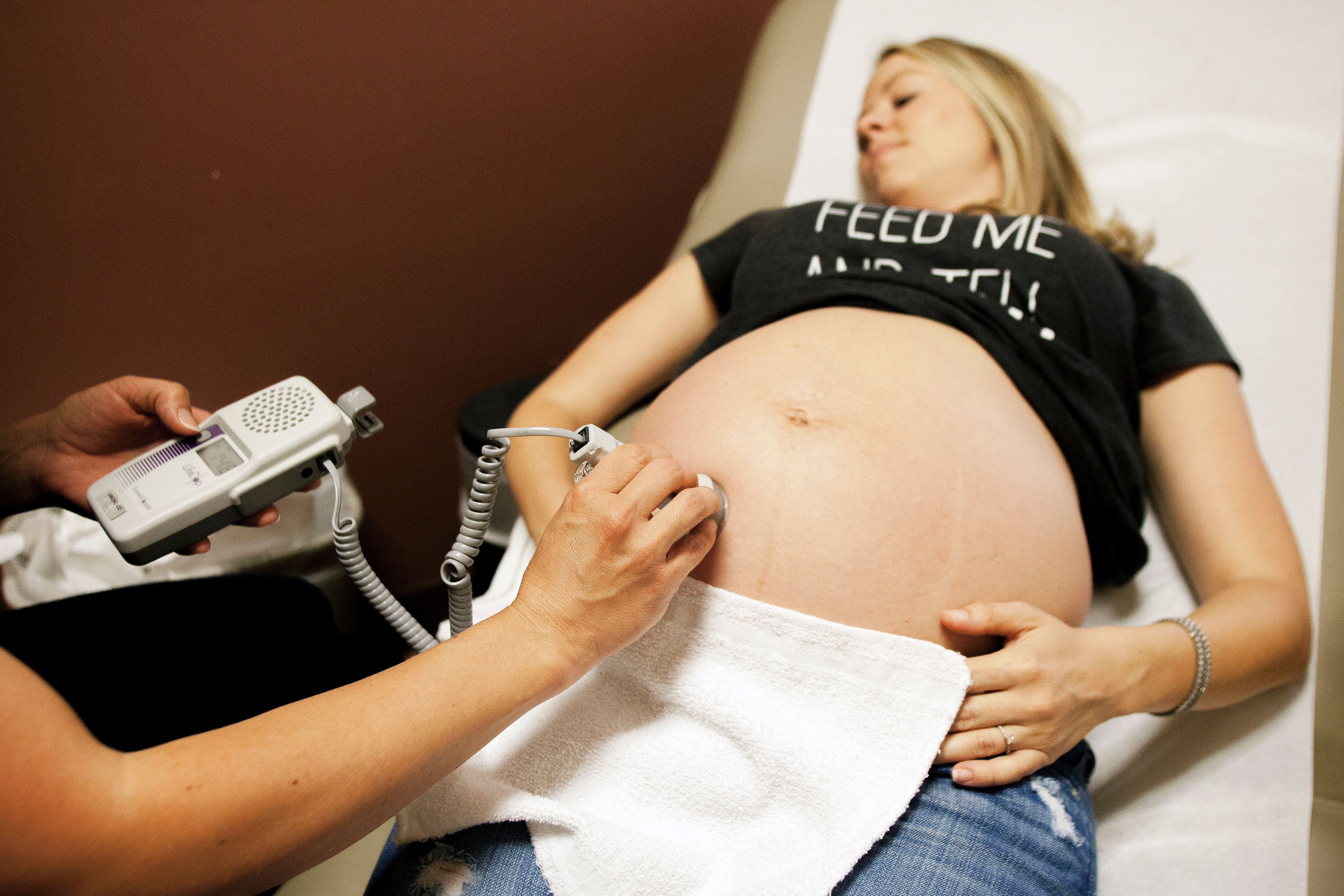 A nurse performs an ultrasound to hear Harper Rose's heartbeat during Traci Howells' weekly prenatal checkups at the Smiley Lane OB/GYN clinic on Wednesday April 27, 2016. Traci plans on having a "low-intervention delivery" at MU Women's and Children's Hospital.