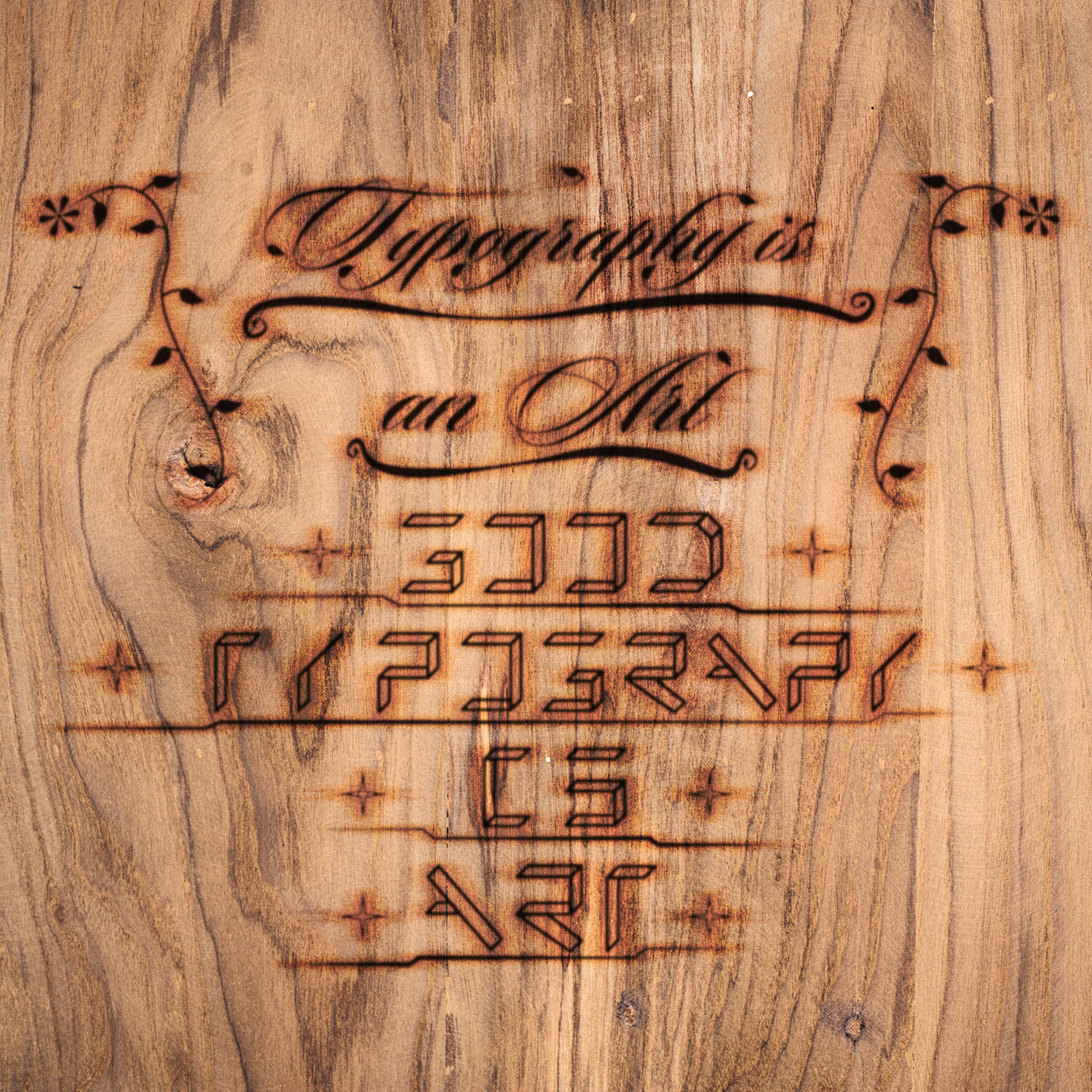 Wood burn effect of the words "Typography is an Art, Good Typography is Art".