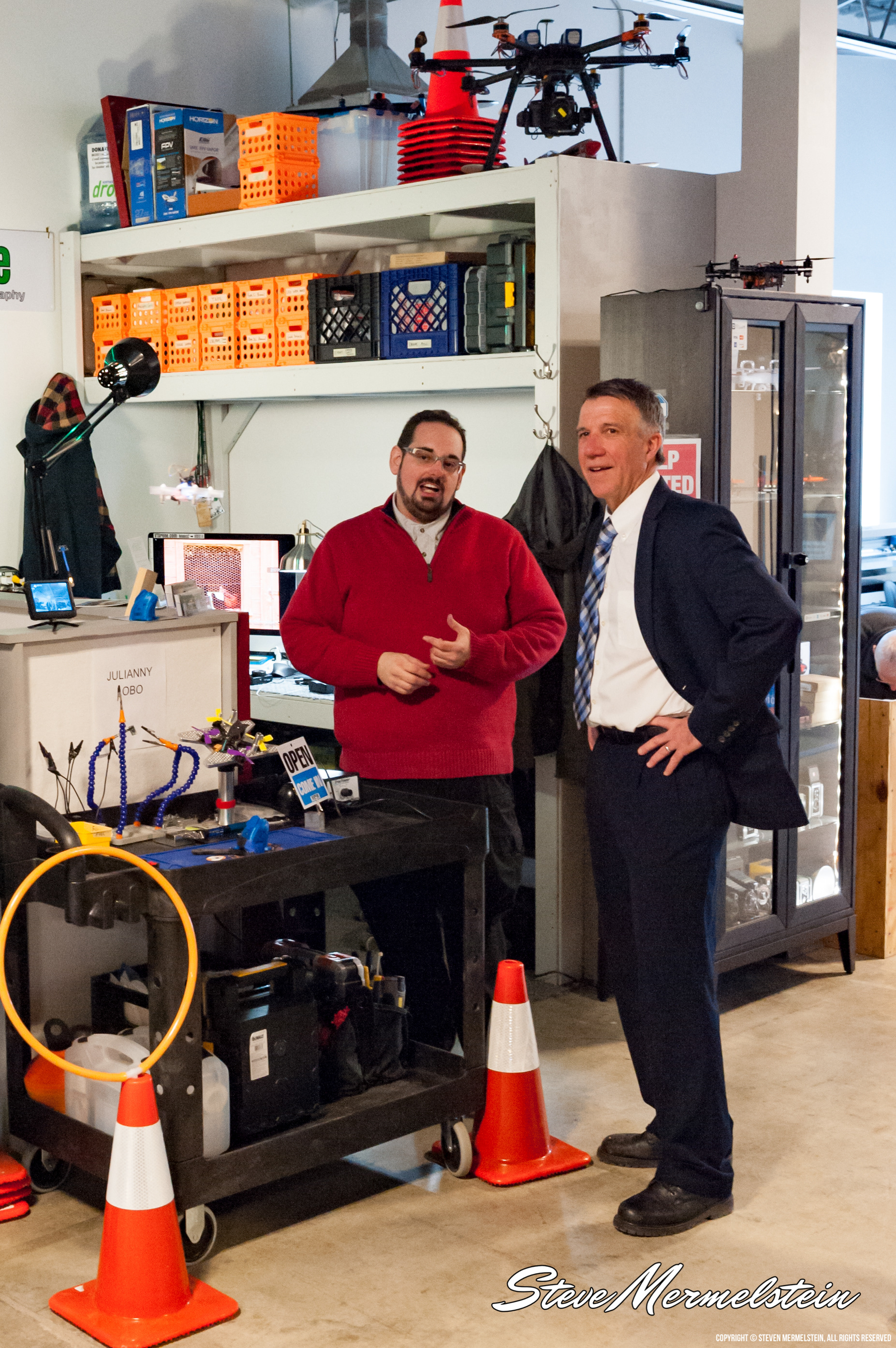 Steve Mermelstein gives a tour of Vermont Drone's studio to Vermont Governor Phil Scott.