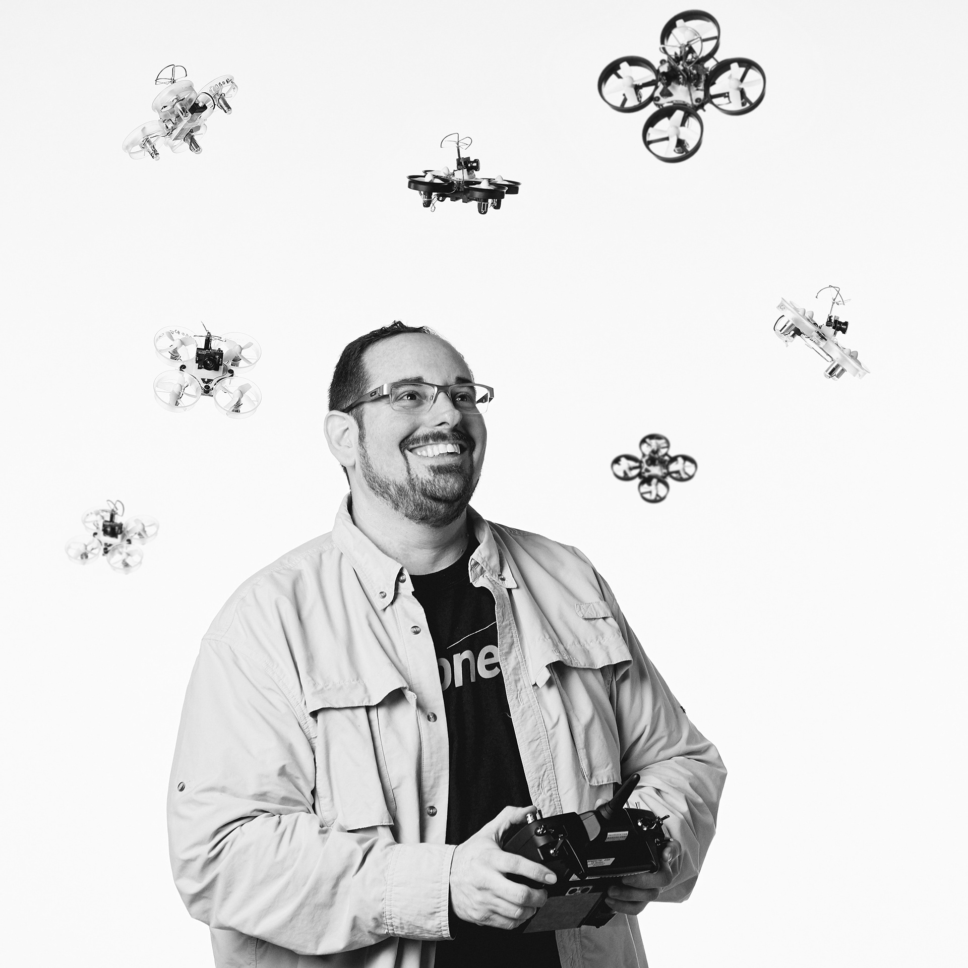 Photograph of Vermont Photographer and Cinematographer Steve Mermelstein flies dozens of tinywhoop drones indoors.