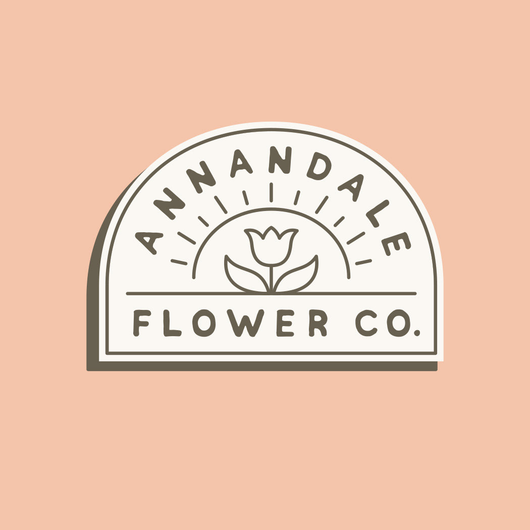 Cresent logo design for Annandale Flower Co. - design features a simple flower growing in front of the sun in an apothecary style logo.