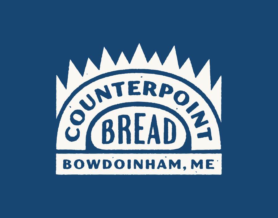 Logo design for Counterpoint Bread in Bowdoinham, Maine, featuring a white reversed logo design of an abstract loaf of rustic bread baking in a wood fired oven with flames and drawn in a rustic vintage print style with the words and type inside the shapes, by Scott Whitehouse.
