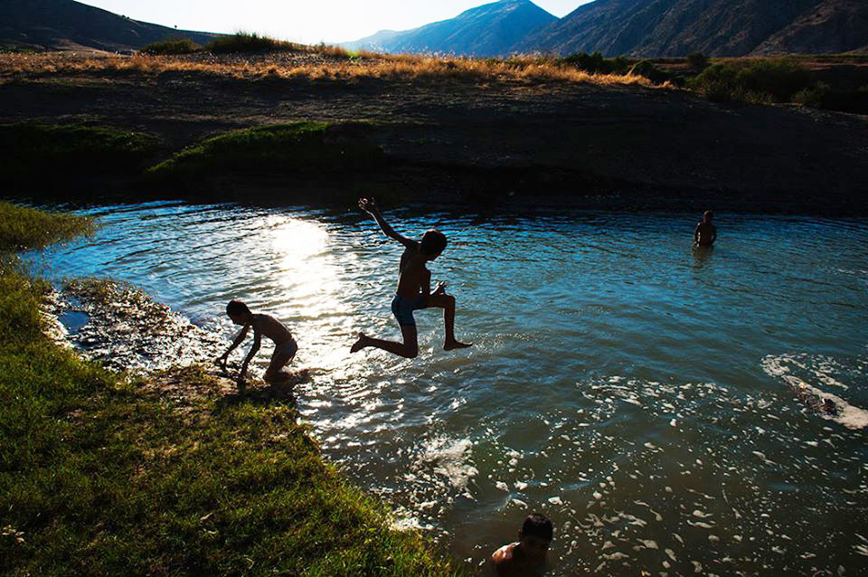 Local children cool off in the Tigris River, whose waters have sustained communities across Mesopotamia for thousands of years.