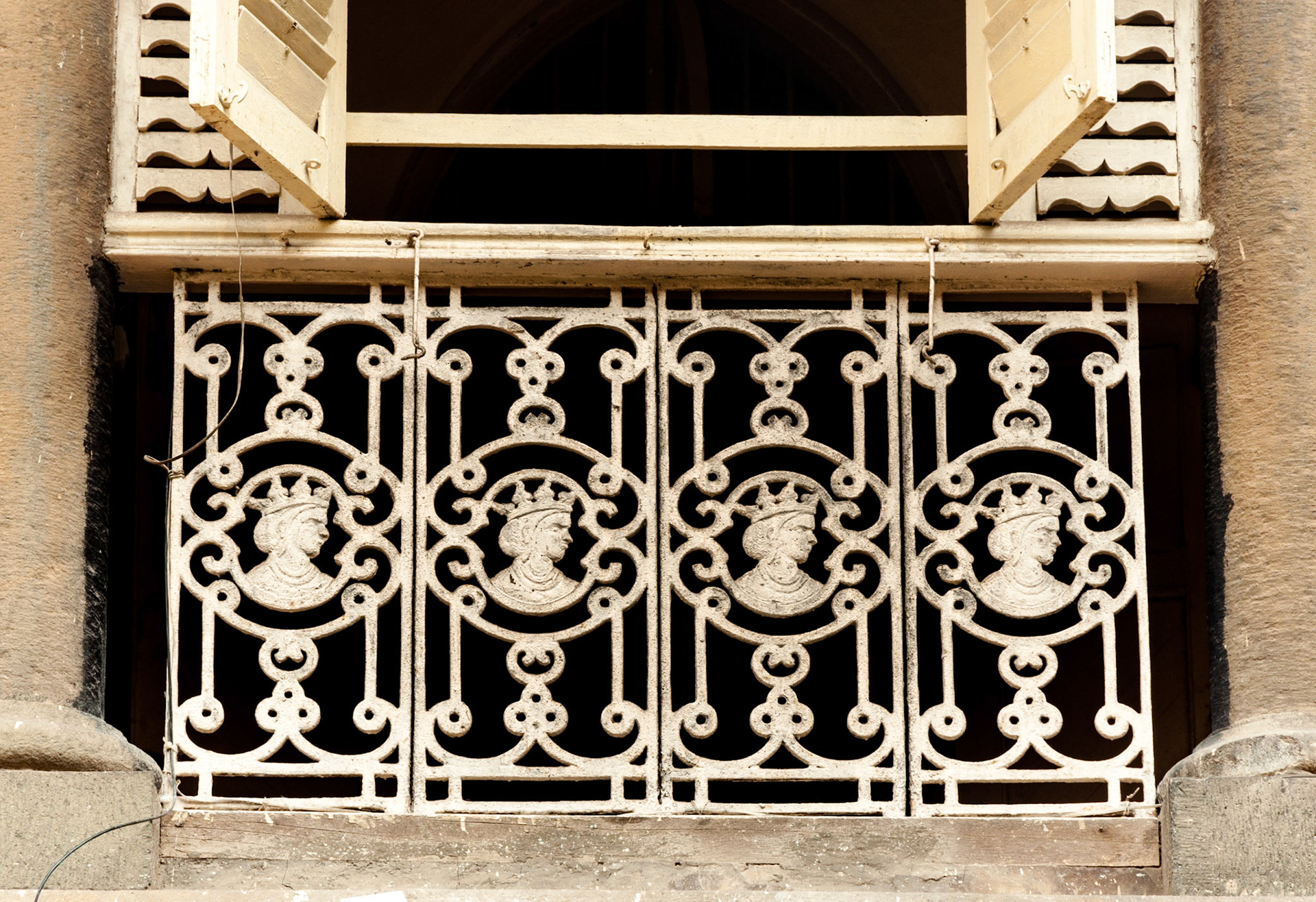 MUMBAI, INDIA – October 23 2017: Vintage cast iron railings showing effigy of Queen Victoria, on a residential building.