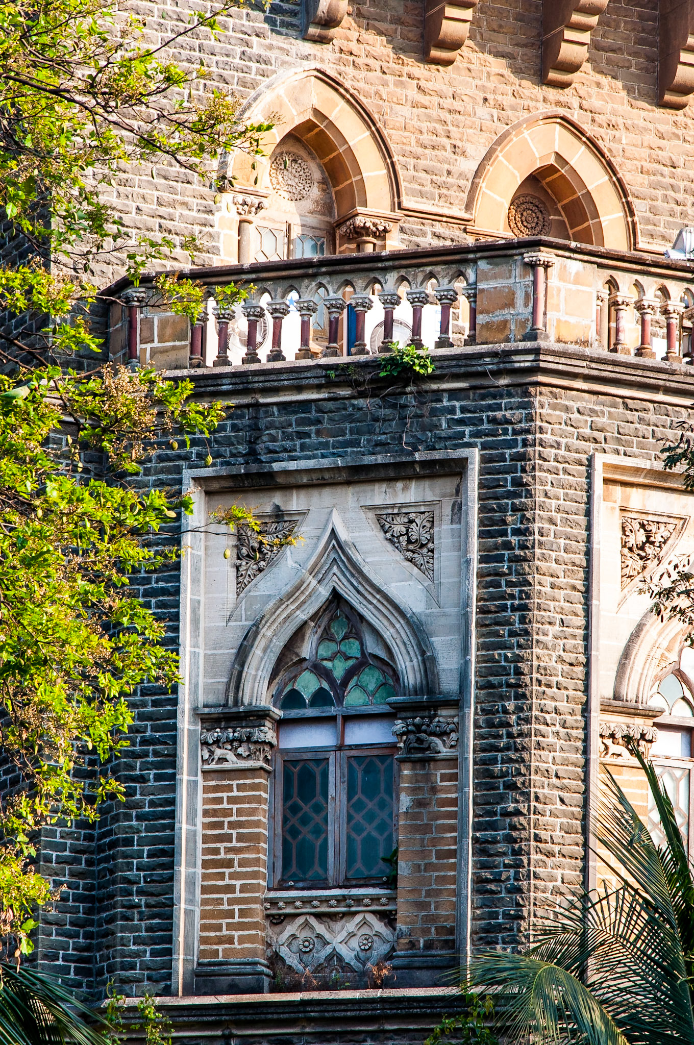 Ornate windows in the stone building of Bombay High court