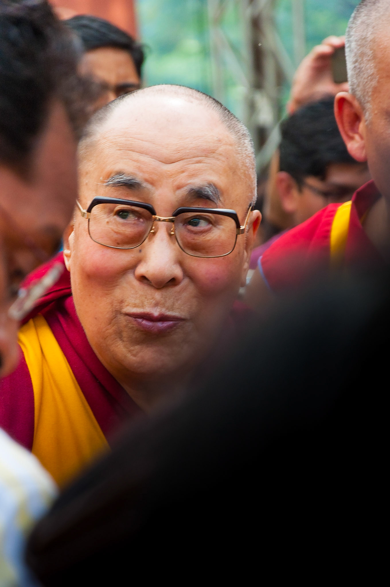 MUMBAI, INDIA – December 10 2017: The 14th Dalai Lama in the midst of a crowd as he enters Somaiya college to give a spiritual lecture.