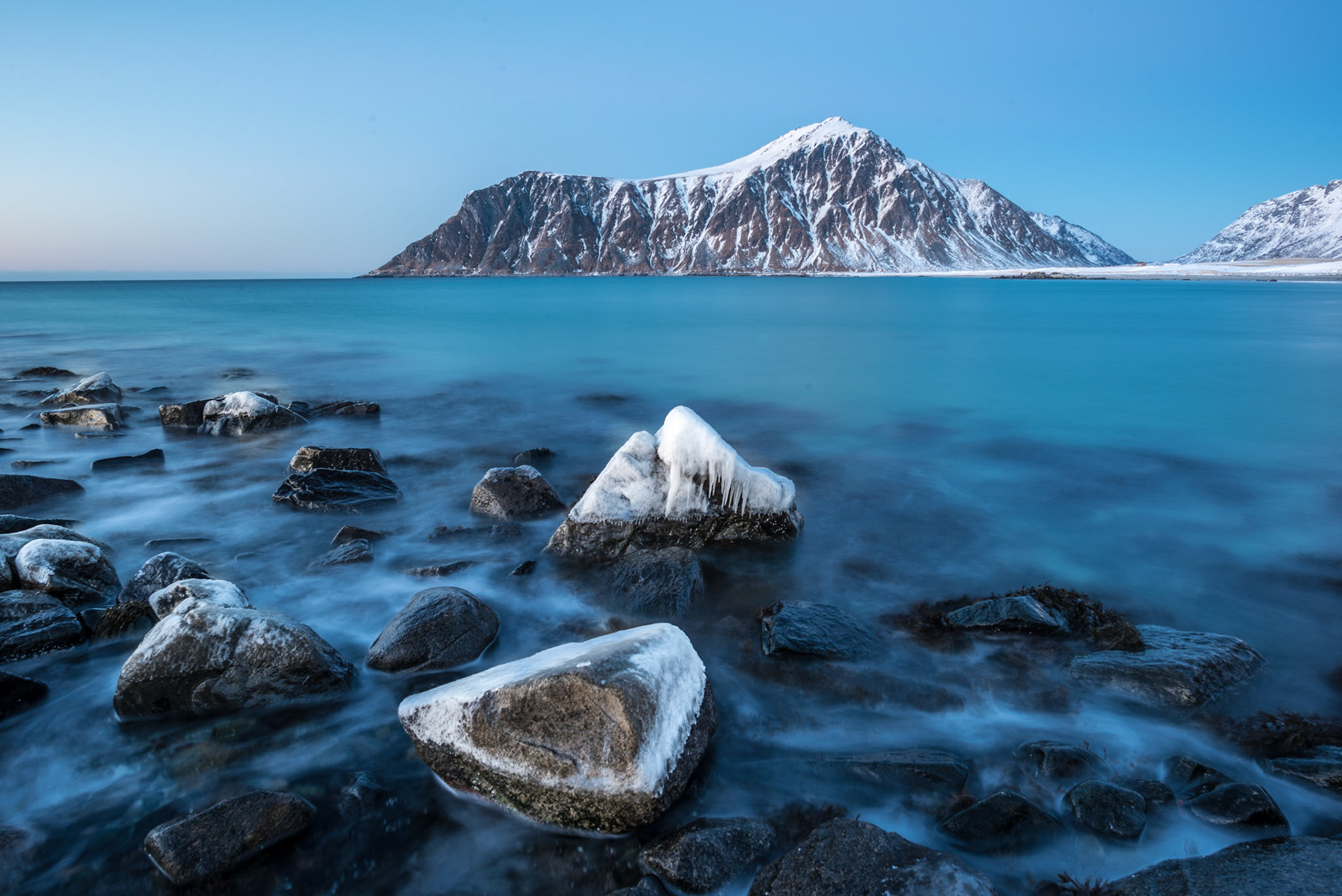 Frozen rocks on Skagsanden beach in Lofoten Norway