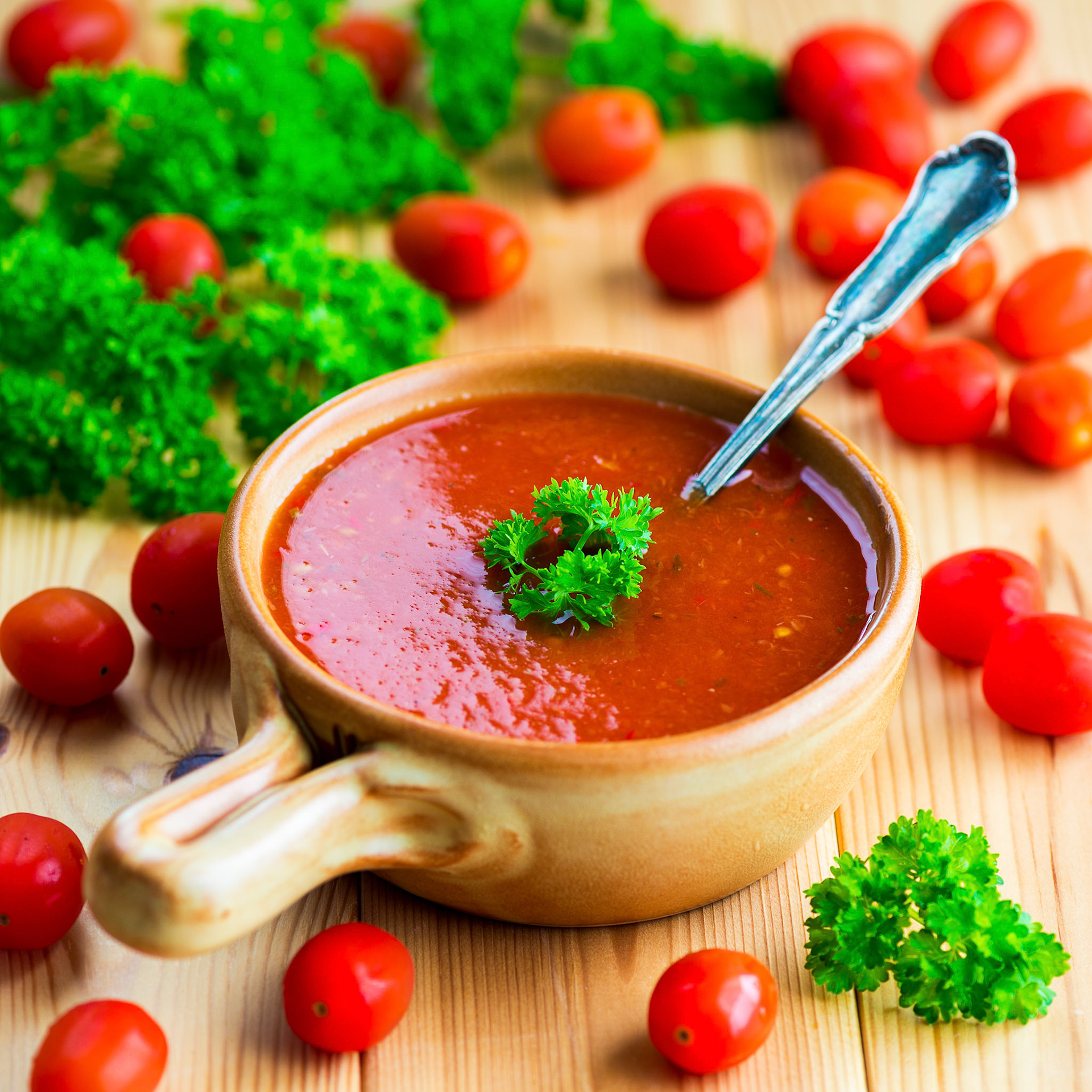 Tomato and pepper soup decorated with parsley