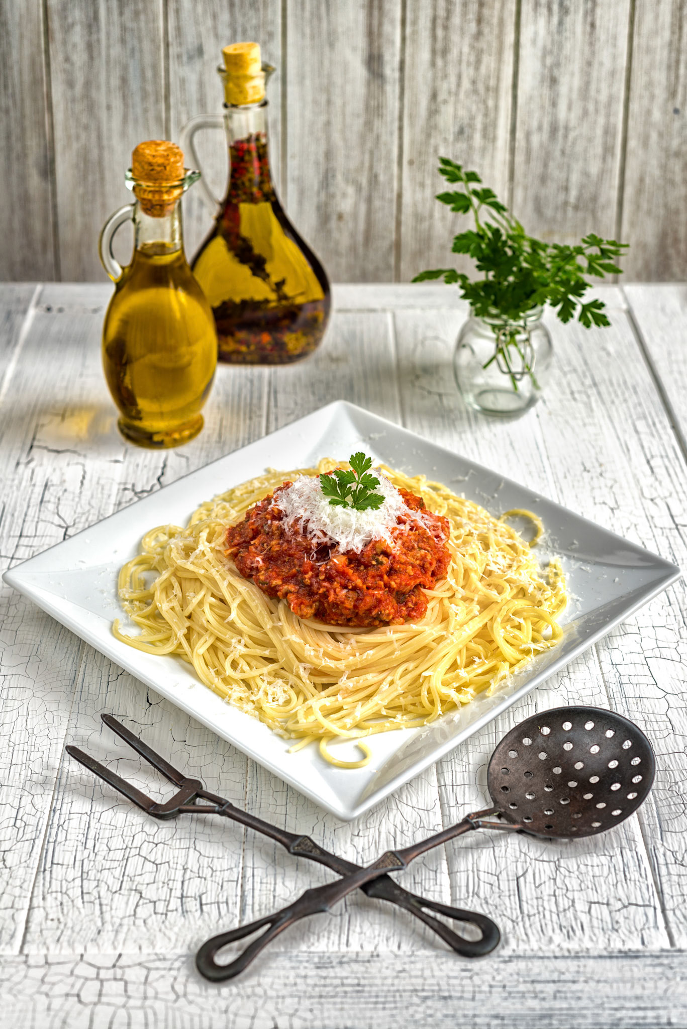 Spaghetti bolognese on a white vintage table