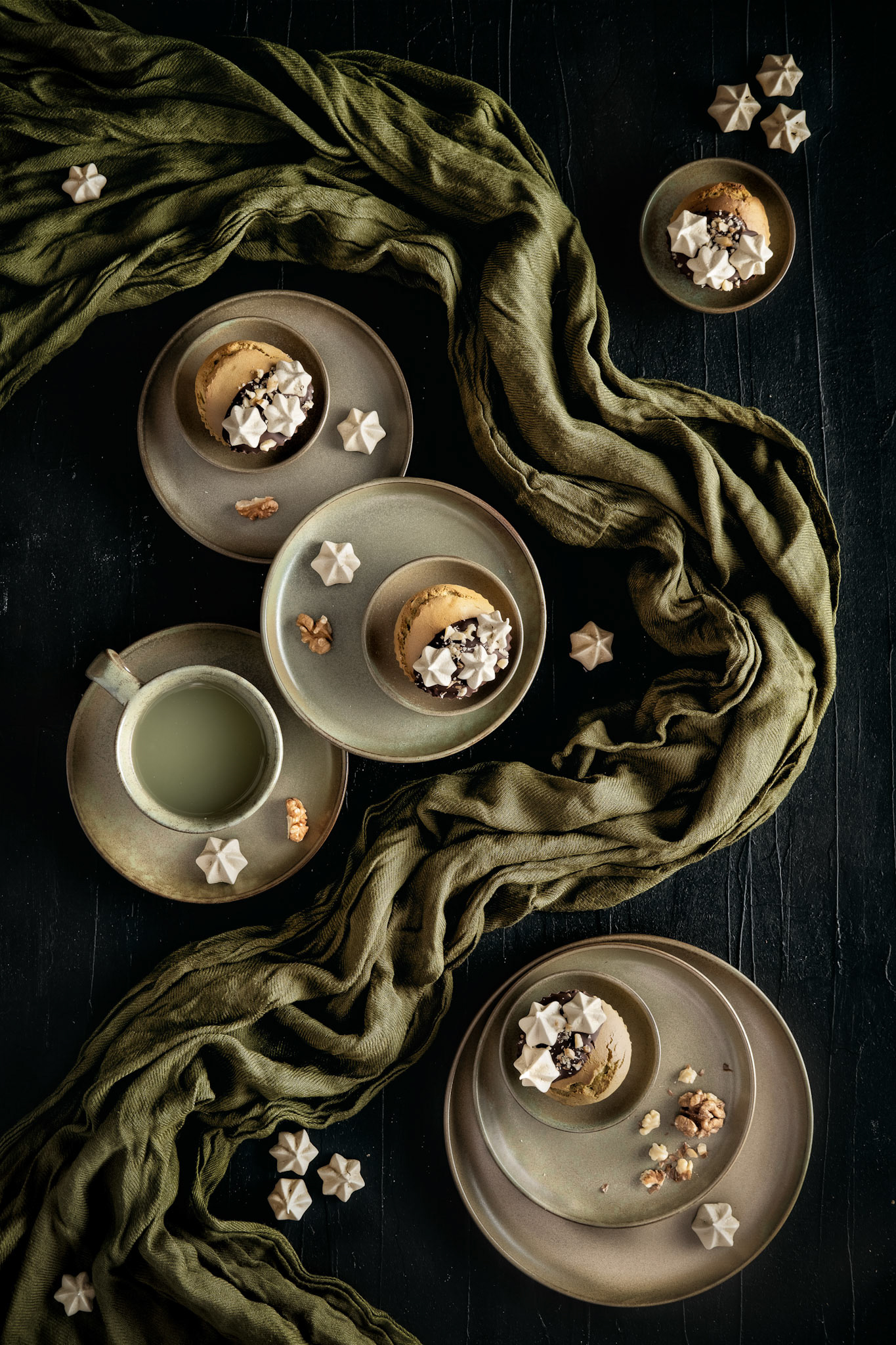 Matcha muffins with meringues, walnuts and chocolate decorations