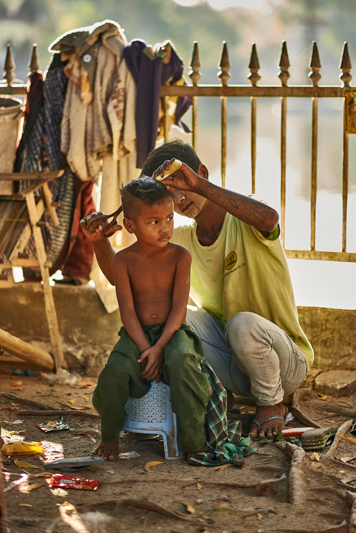 Having a new harcut on the streets of Mandalay, Myanmar