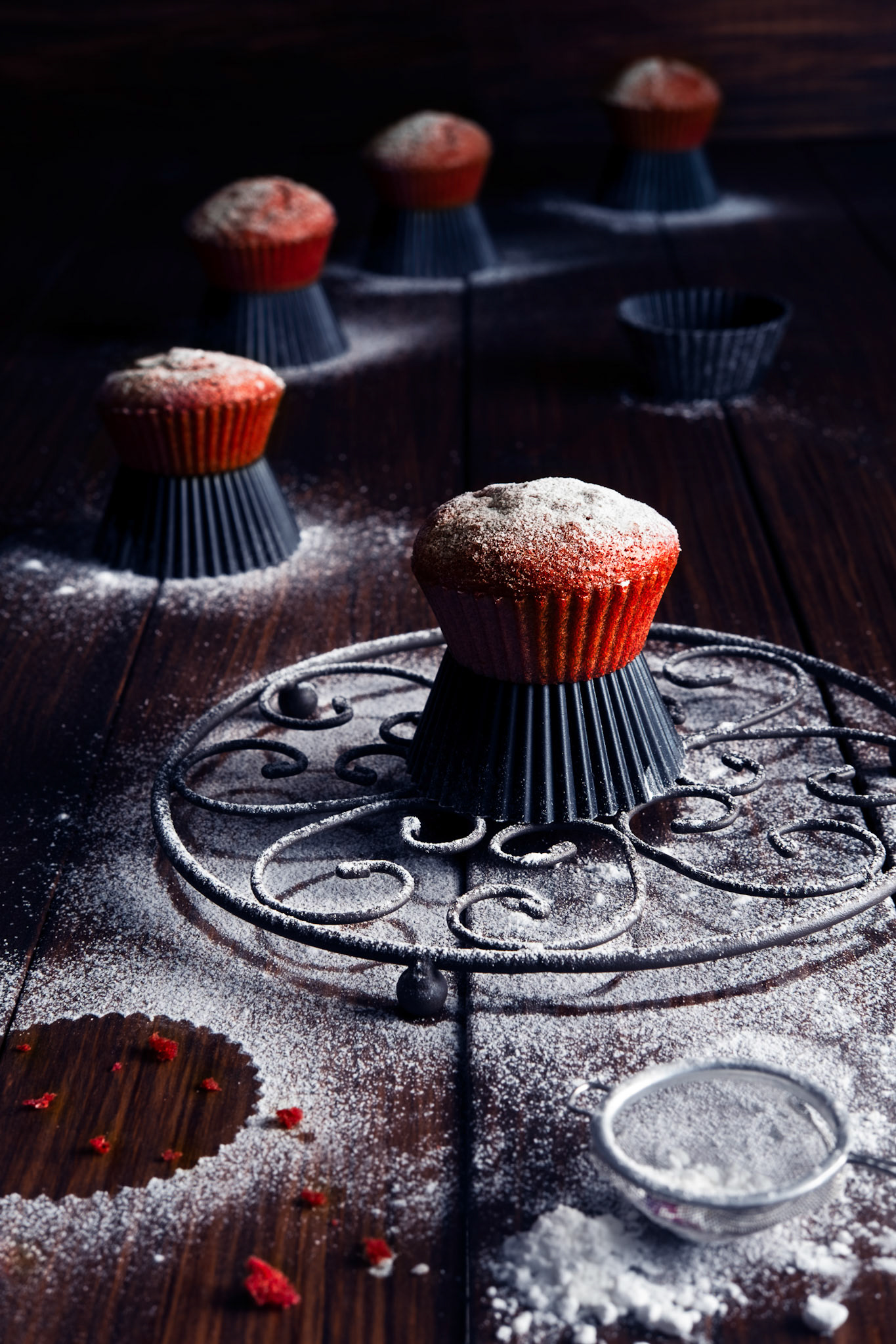 Red velvet muffins with icing sugar decoration