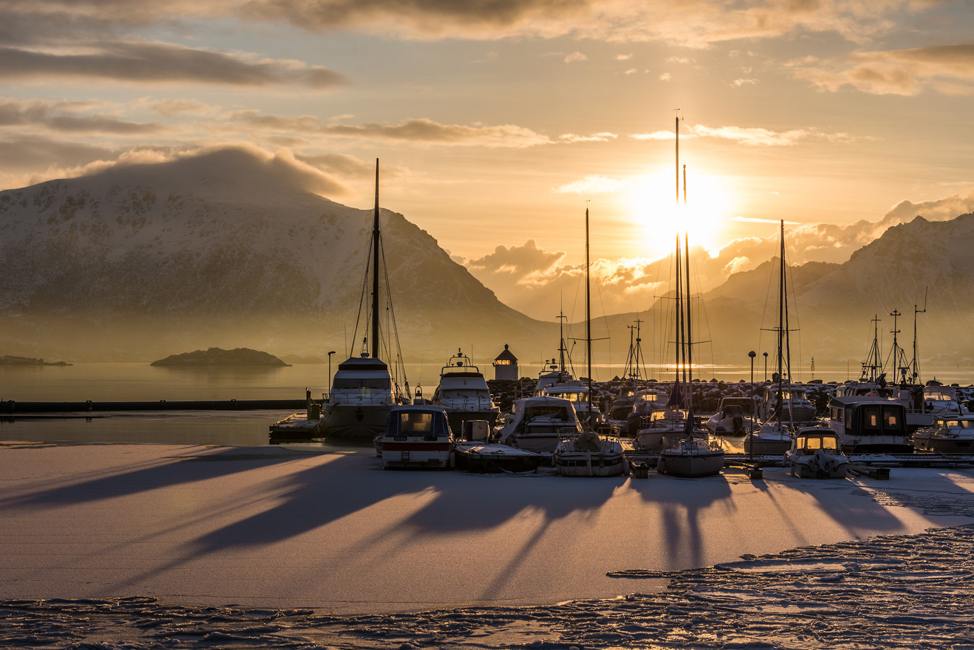 Sunrise in a small port with boats in Lofoten, Norway
