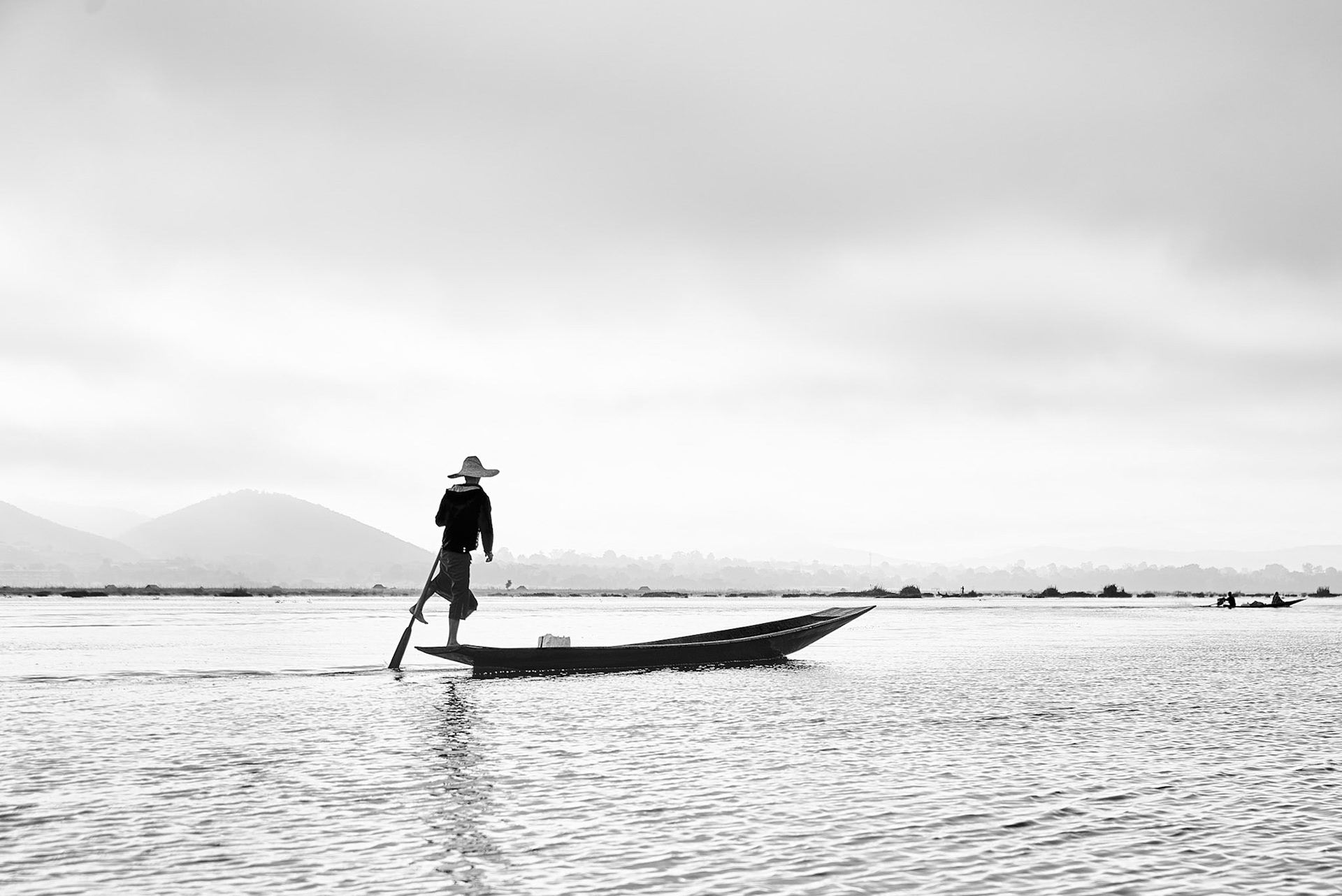 It is rare to see a fisherman still fishing in a traditional way. Most of them use motorboats and improved fishnets. This is one of the few I have seen still fishing the old way.