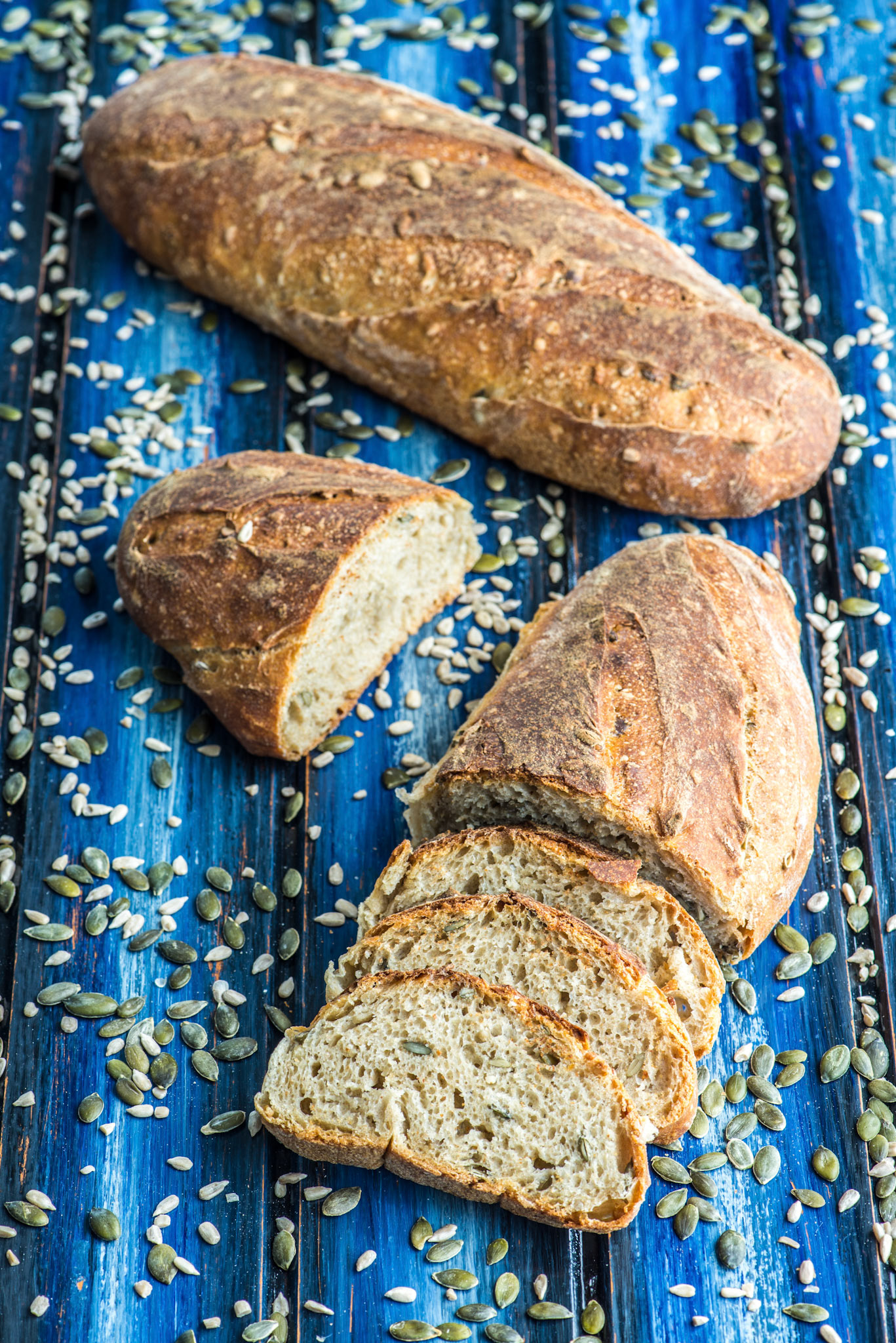 Spelt seed sourdough bread on a blue tableboard