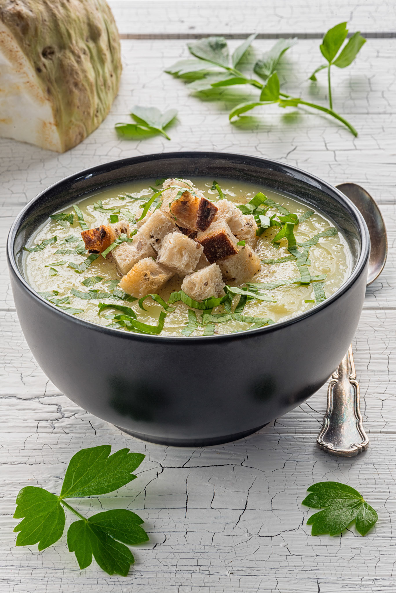 Celery soup with fresh parsley and croutons