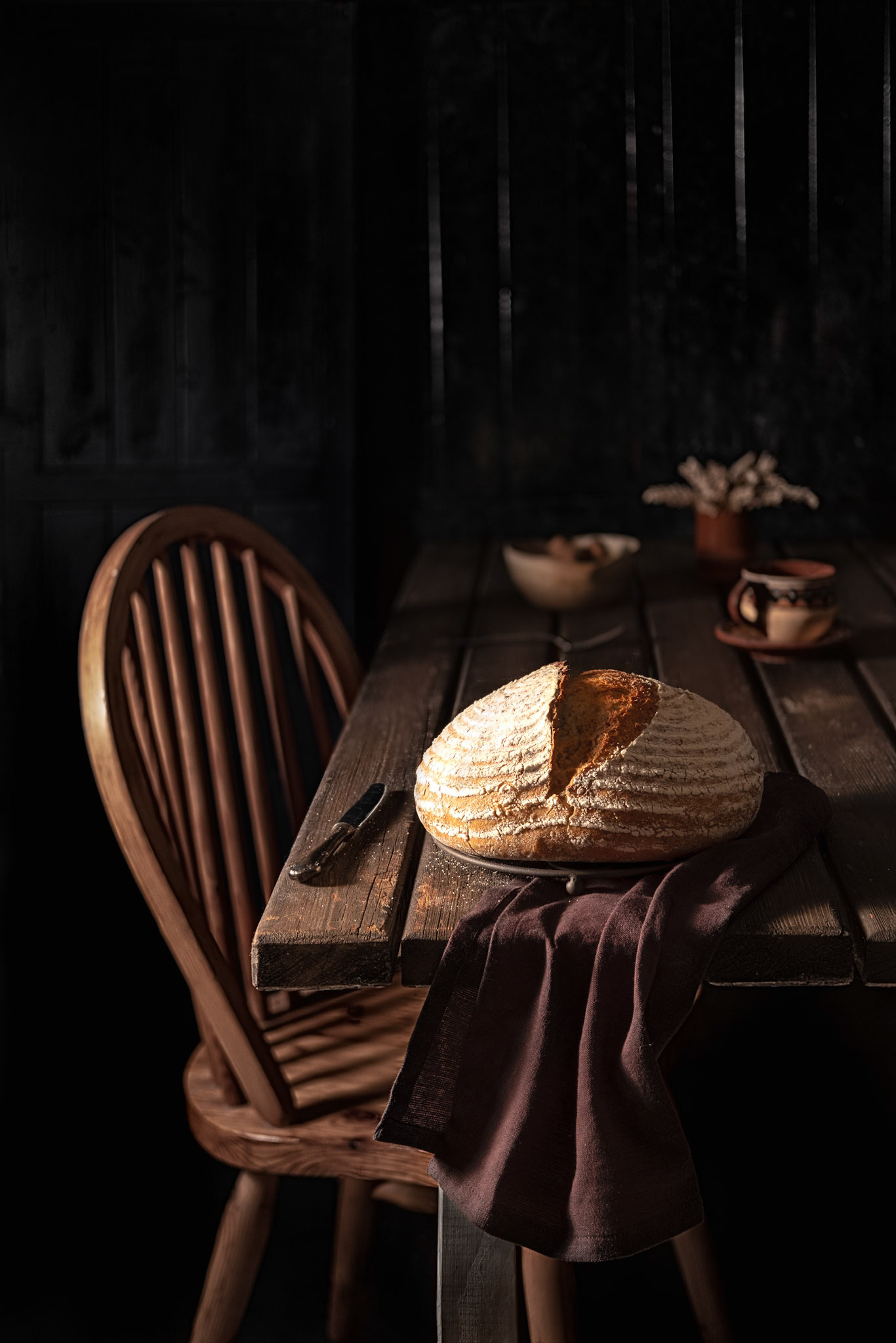 Mixed flour country bread on a wooden rustic table