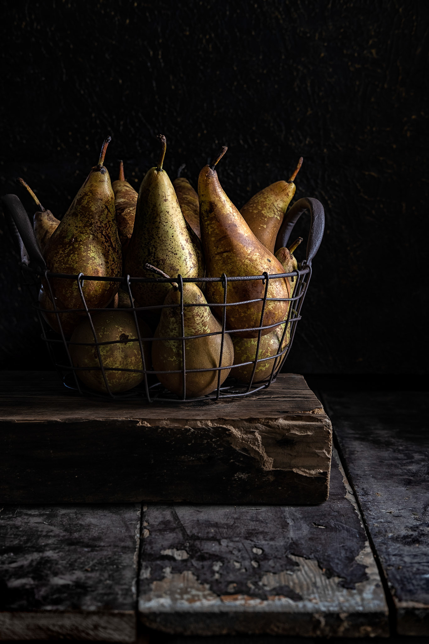 Basket of pears on an old table