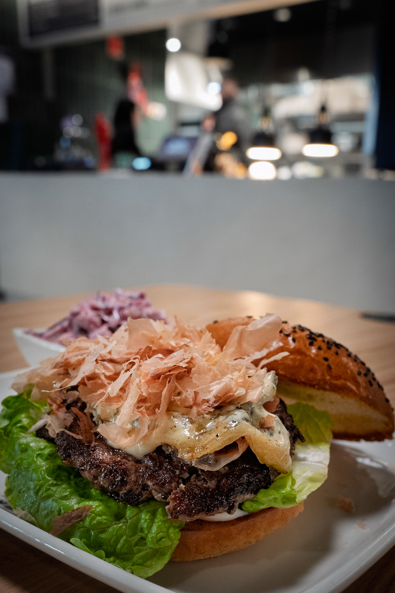 Tuning Burger | Umami Burger: house-made bun, yakitori mayo, romaine lettuce, shiitake mushroom, beef patty, black forest ham, bluecheese, tuna flakes