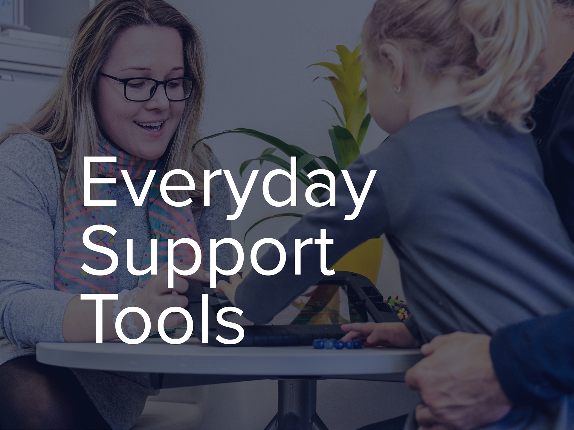 Everyday Support Tools heading overlaid on a photo of a Speech Pathologist showing an ipad to a young girl and her father