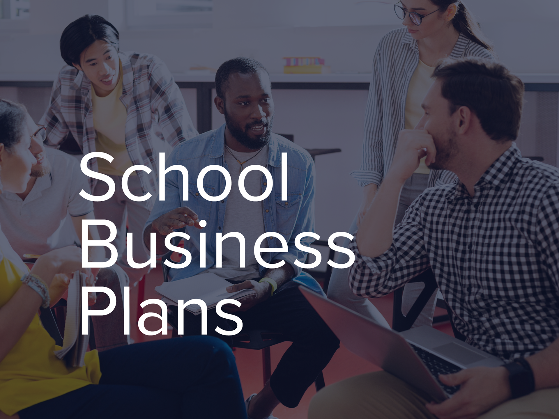 School Business Plans heading overlaid on a photo of teachers sitting together having a meeting