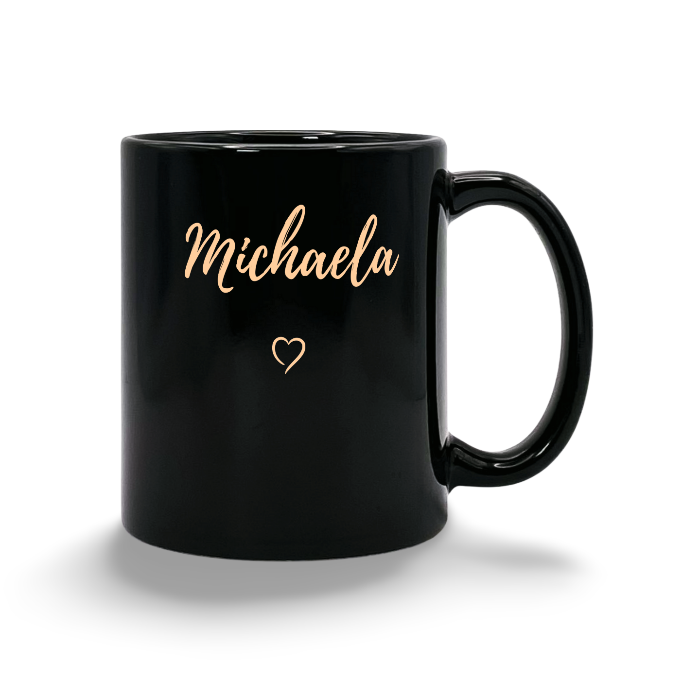 Schwarze Tasse mit dem goldenen Schriftzug 'dein Name' und einem kleinen Herz darunter