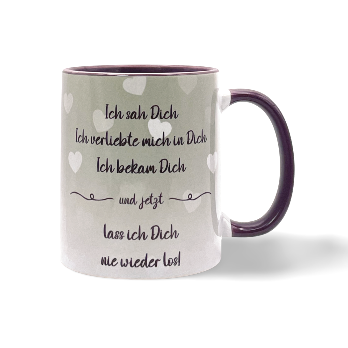 Tasse mit Herzmotiven und dem Text 'Ich sah Dich Ich verliebte mich in Dich Ich bekam Dich und jetzt lass ich Dich nie wieder los'