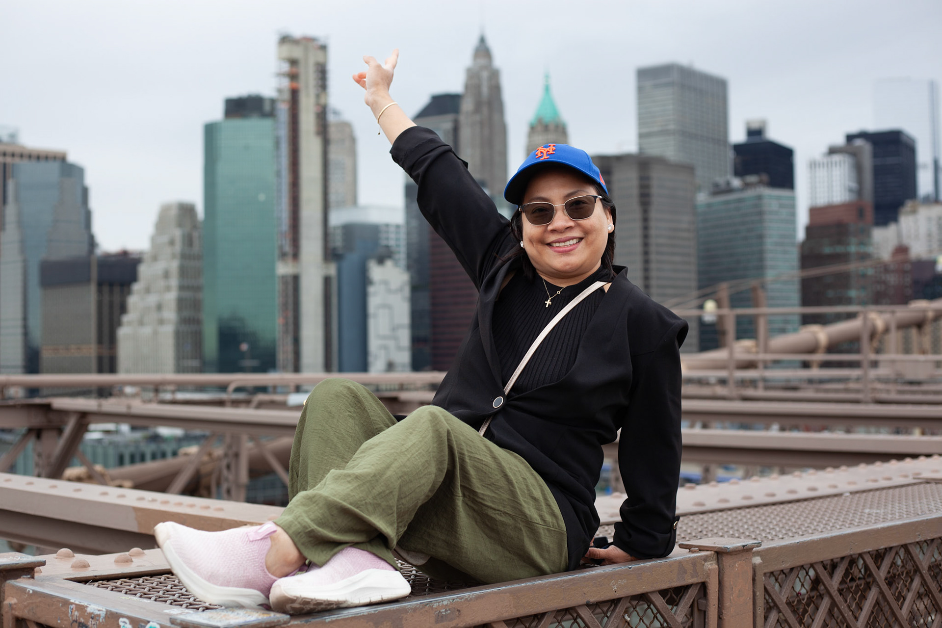 Cecile on Brooklyn Bridge with Manhattan in Background, NY.