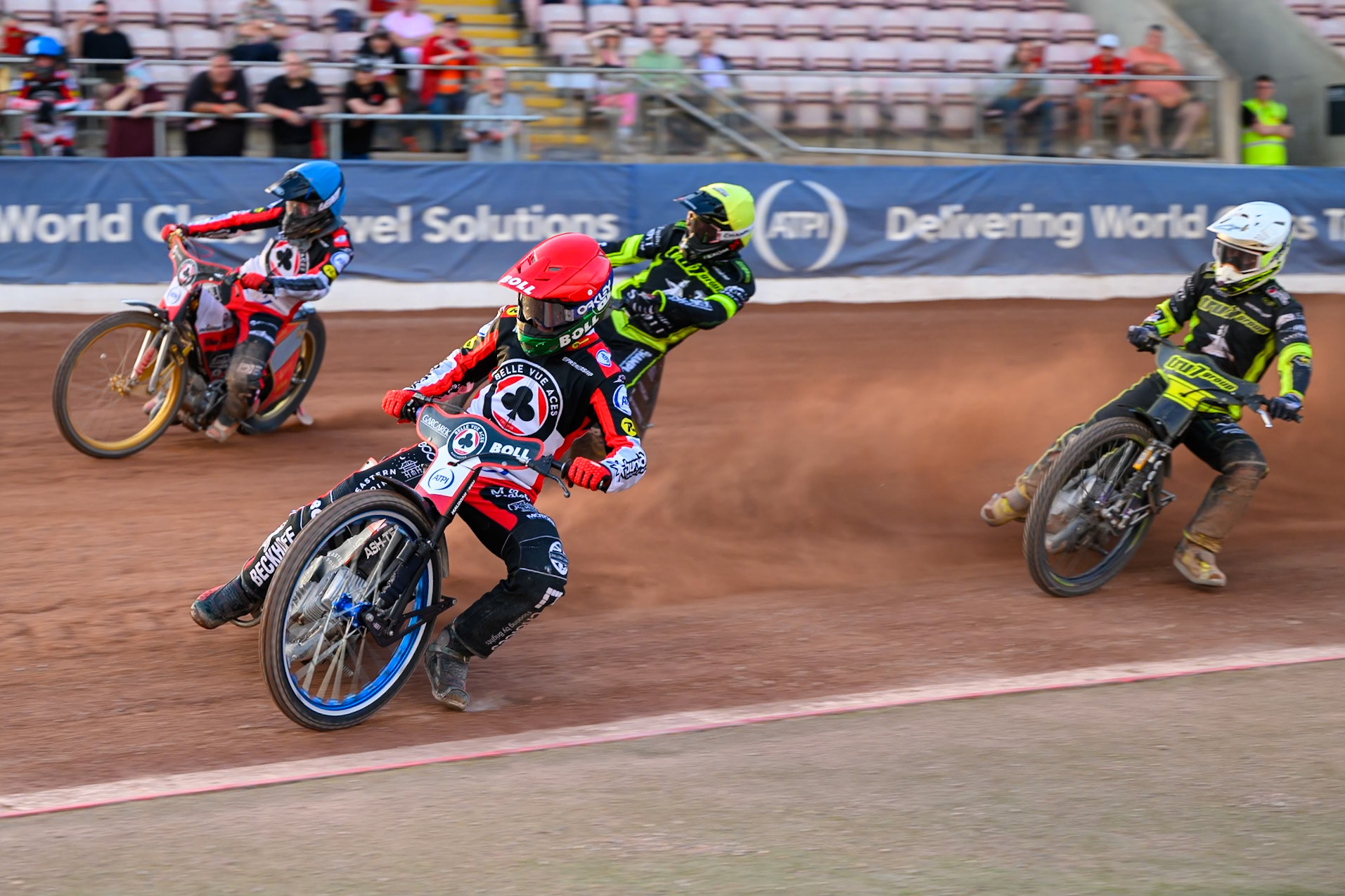 Brady Kurtz of Belle Vue Aces in Red and Norick Blödorn of Belle Vue Aces in Blue leading Tom Brennan of Ipswich Witches in White and Tobiasz Musielak of Ipswich Witches in Yellow during the Rowe Motor Oil Premiership match between Belle Vue Aces and Ipswich Witches at the National Speedway Stadium, Manchester on Saturday 20th June 2026. (Photo: Ian Charles | MI News)