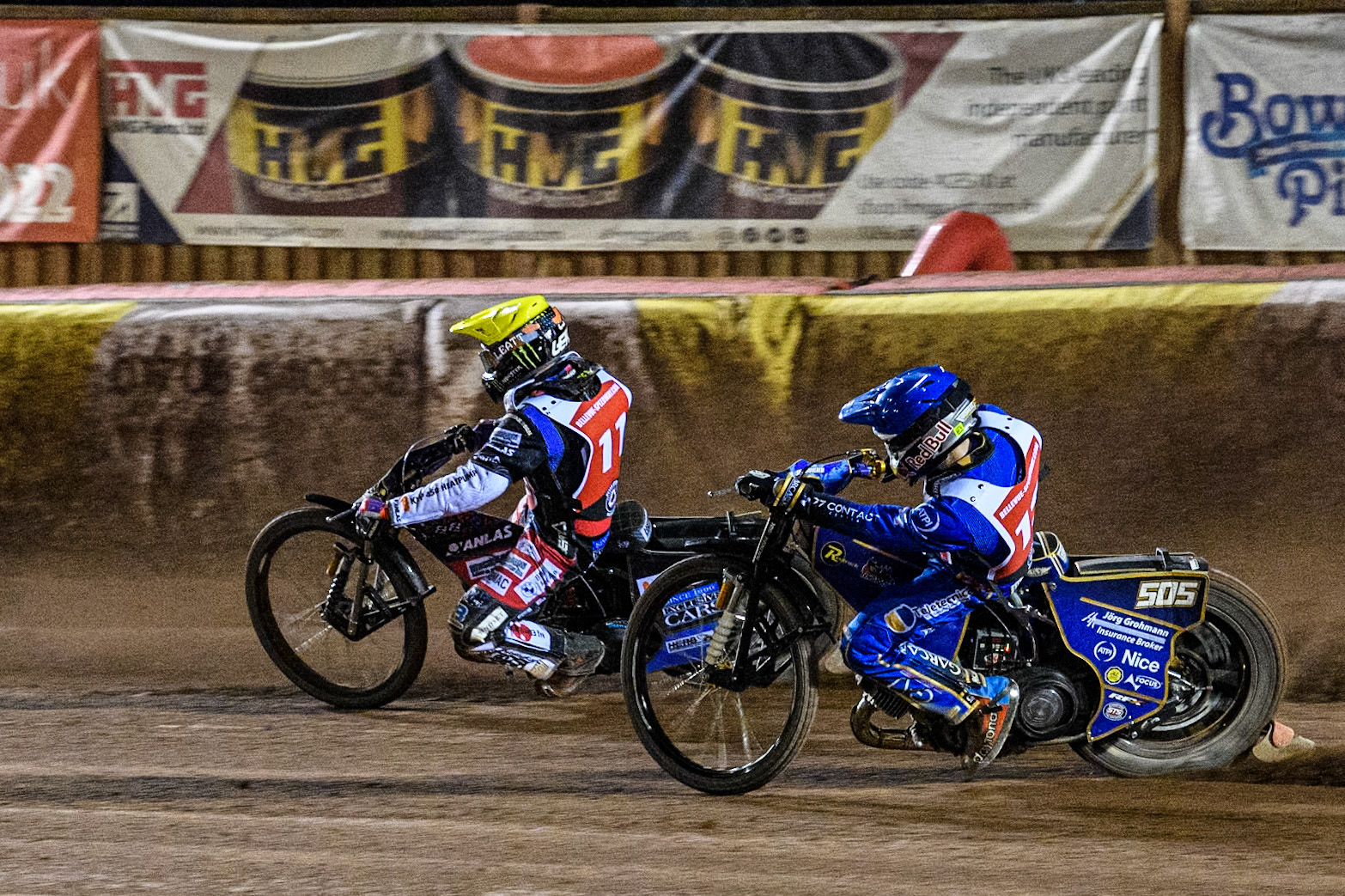 England's Robert Lambert (Blue) chases Sweden’s Fredrik Lindgren (Yellow) during the Peter Craven Memorial Trophy meeting at the National Speedway Stadium, Manchester on Monday 18th March 2024. (Photo: Ian Charles | MI News)