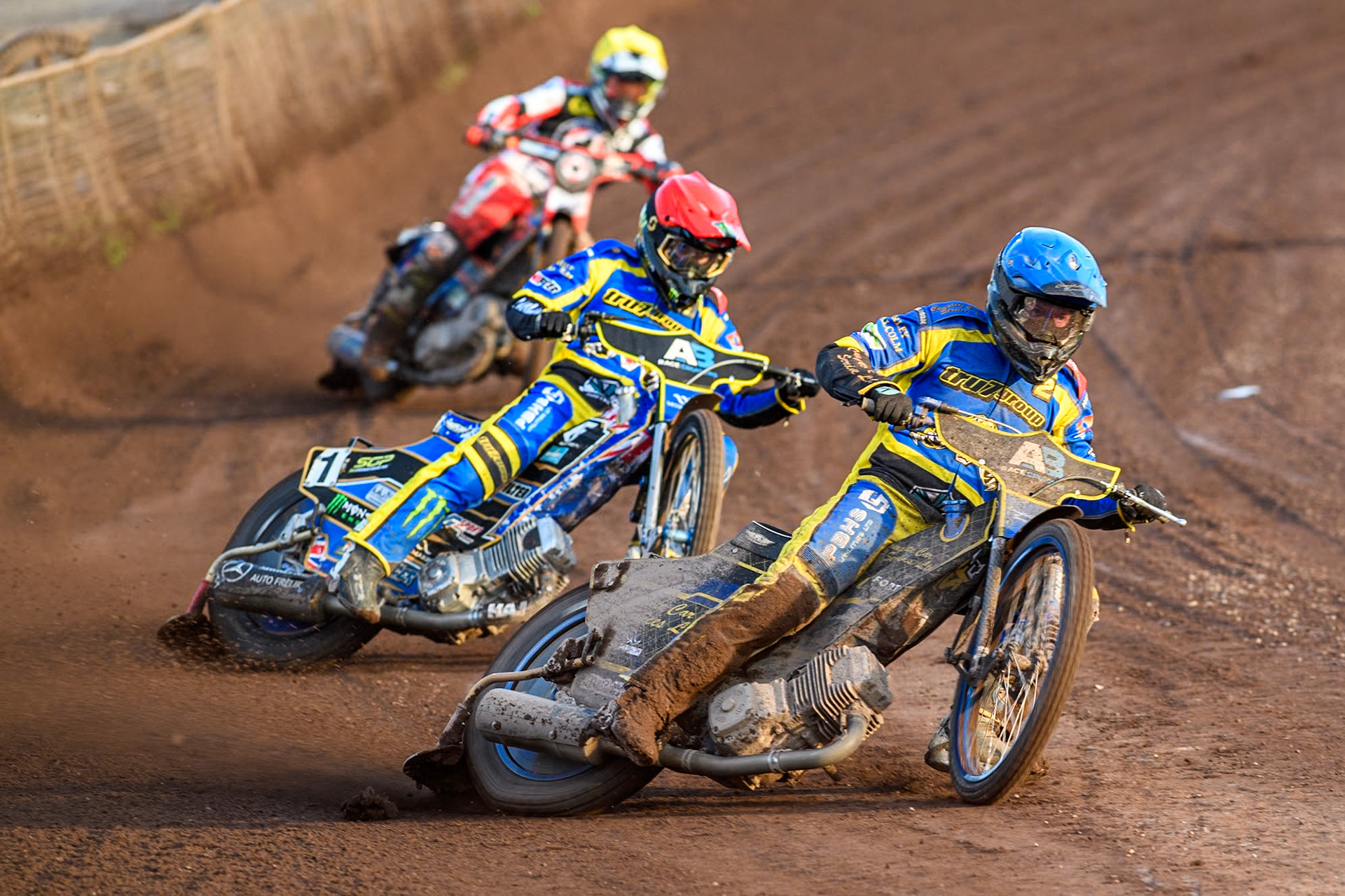 Sheffield Tigers' Kyle Howarth  in Blue leading Sheffield Tigers' Jack Holder  in Red and Belle Vue Aces' Connor Mountain in Yellow during the Premiership KO Cup Quarter Final, 2nd Leg match between Sheffield Tigers and Belle Vue Aces at Owlerton Stadium, Sheffield on Thursday 9th May 2024. (Photo: Ian Charles | MI News)