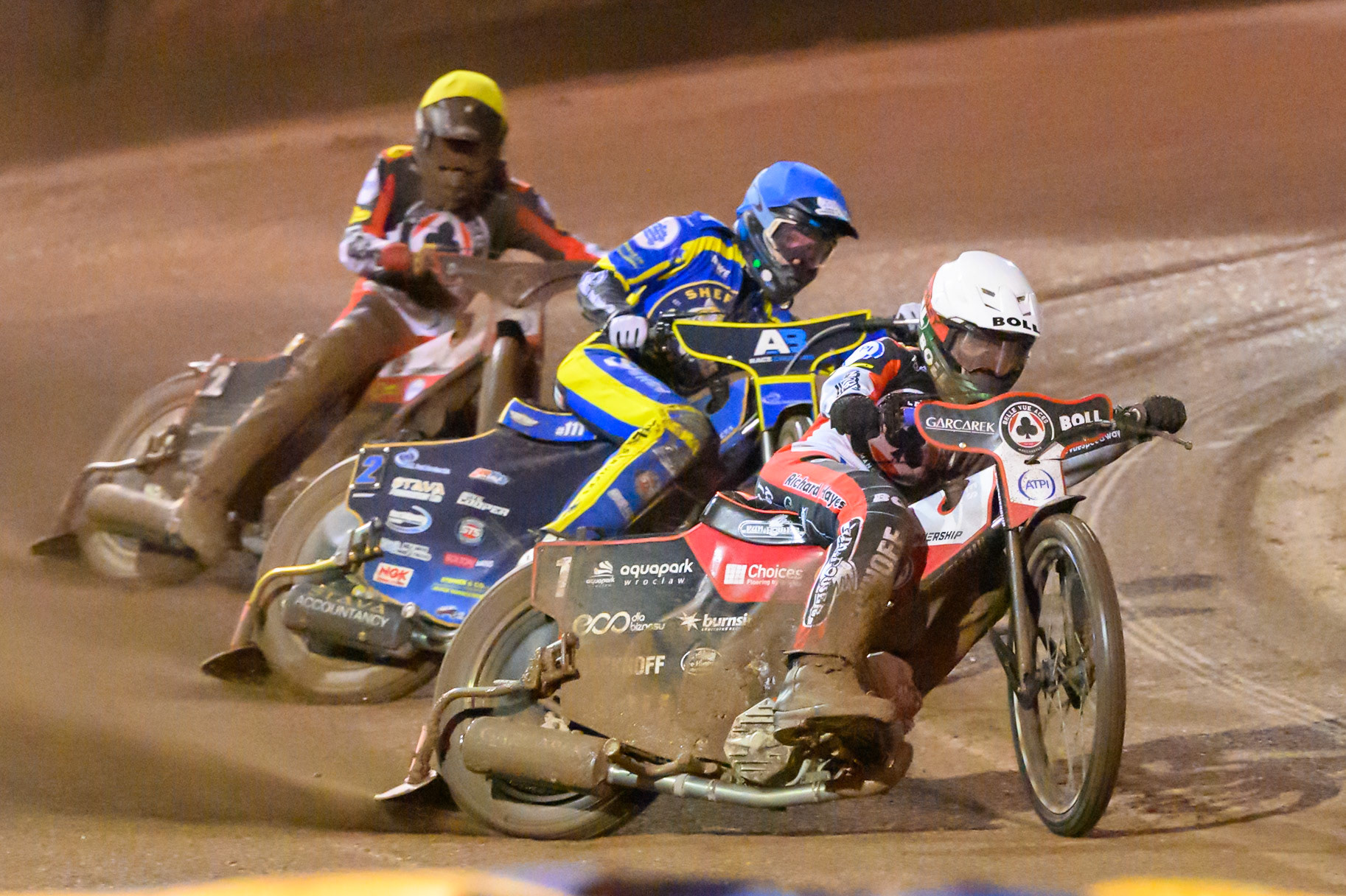 Brady Kurtz of Belle Vue Aces in White leading Anders Rowe of Sheffield Tigers in Blue and Norick Blodorn of Belle Vue Aces in Yellow during the Rowe Motor Oil Premiership Grand Final 1st Leg match between Sheffield Tigers and Belle Vue Aces at Owlerton Stadium, Sheffield on Monday 12th October 2026. (Photo: Ian Charles | MI News)