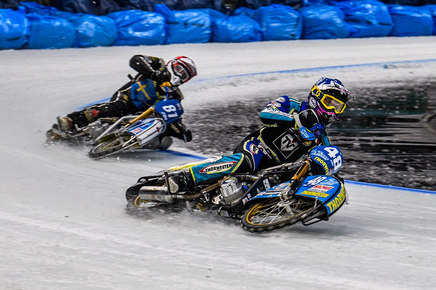 Luca Bauer (48) of Germany in Blue leading Jimmy Olsén (81) of Sweden in Red during the Ice Speedway Gladiators World Championship Final 2 at Max-Aicher-Arena, Inzell on Sunday 16th March 2025. (Photo: Ian Charles | MI News)