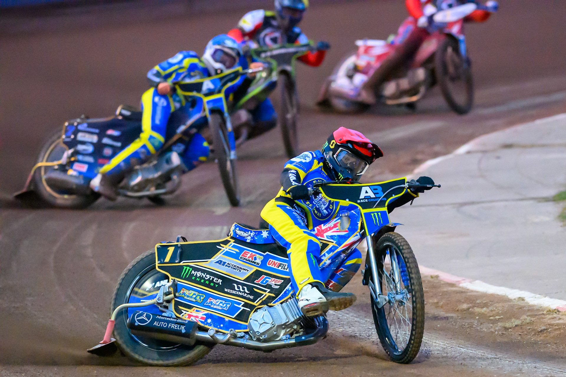 Jack Holder of Sheffield Tigers   in Red leading Anders Rowe of Sheffield Tigers in Blue and Kye Thomson, Guest Rider for Belle Vue Aces  in Yellow during the Knockout Cup Northern Section match between Sheffield Tigers and Belle Vue Aces at Owlerton Stadium, Sheffield on Thursday 2nd April 2026. (Photo: Ian Charles | MI News)