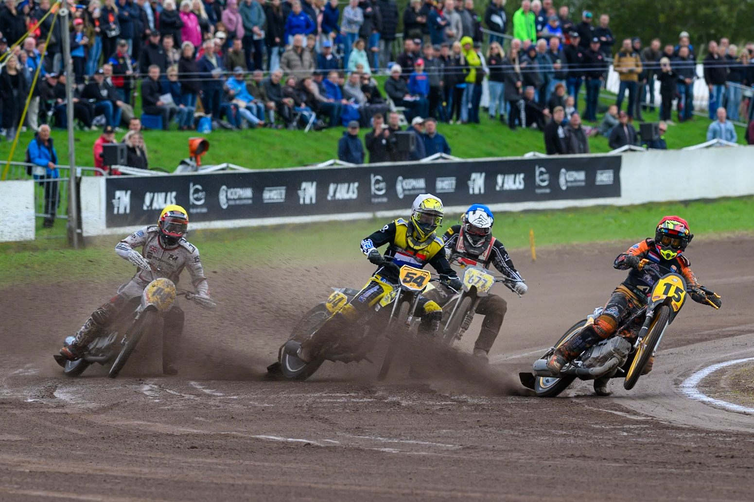 Wild Card Rider Romano Hummel (15) of The Netherlands in Red gets the drop in the first turn ;leading Mika Meijer (54) of The Netherlands in White, Timo Wachs (677) of Germany in Blue and Andrew Appleton (141) of Great Britain in Yellow during the FIM Long Track World Championship Final 4, at the Speed Centre Roden, Netherlands on Sunday 21st September 2025. (Photo: Ian Charles | MI News)during the FIM Long Track World Championship Final 4, at the Speed Centre, Roden on Sunday 21st September 2025. (Photo: Ian Charles | MI News)