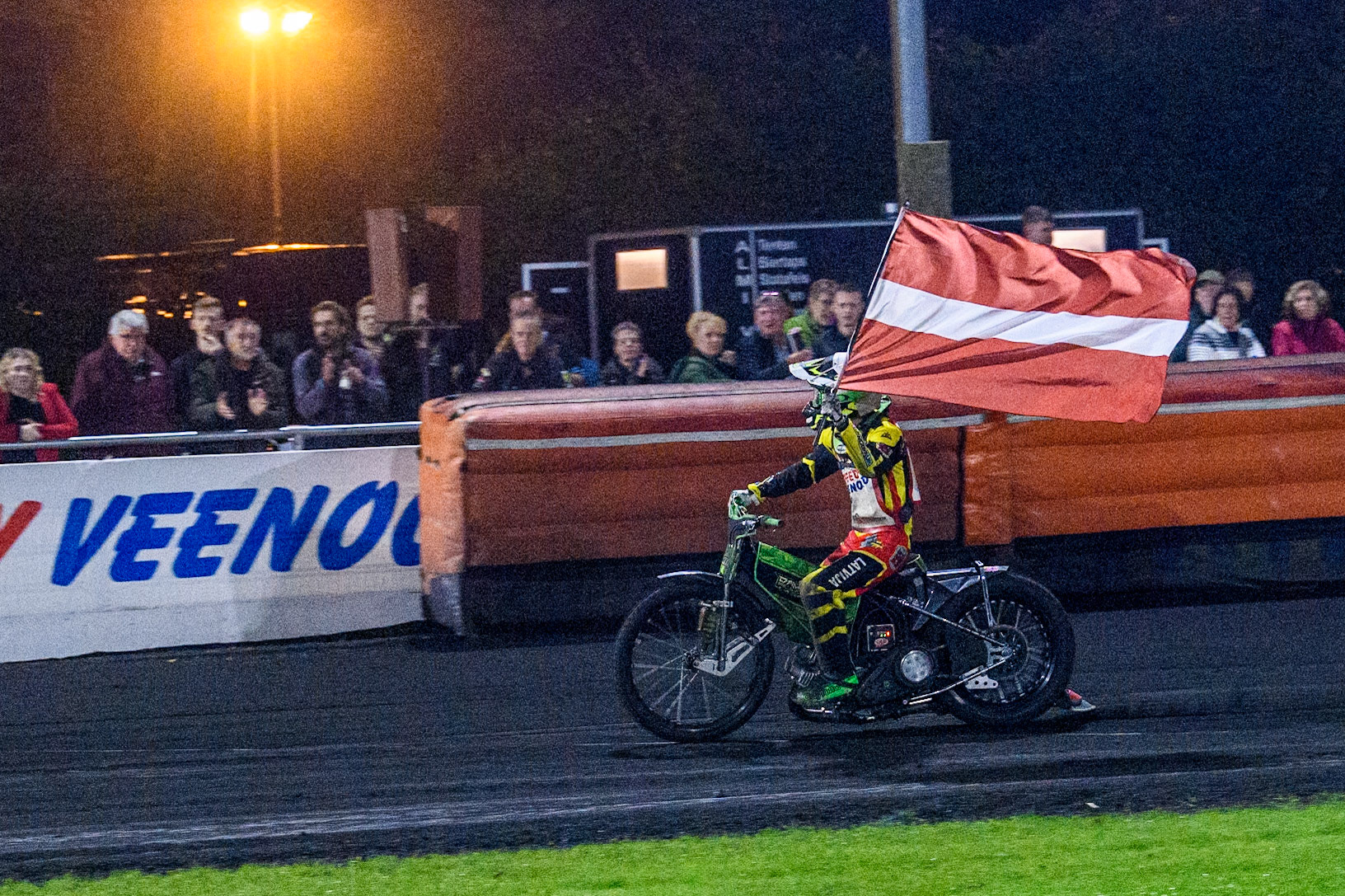 Damirs Filimonov of Latvia with the Latvian flag during the Golden JOPA Helmet at Sportpark Veenoord, Veenoord, Netherlands on Saturday 21st September 2024. (Photo: Ian Charles | MI News)