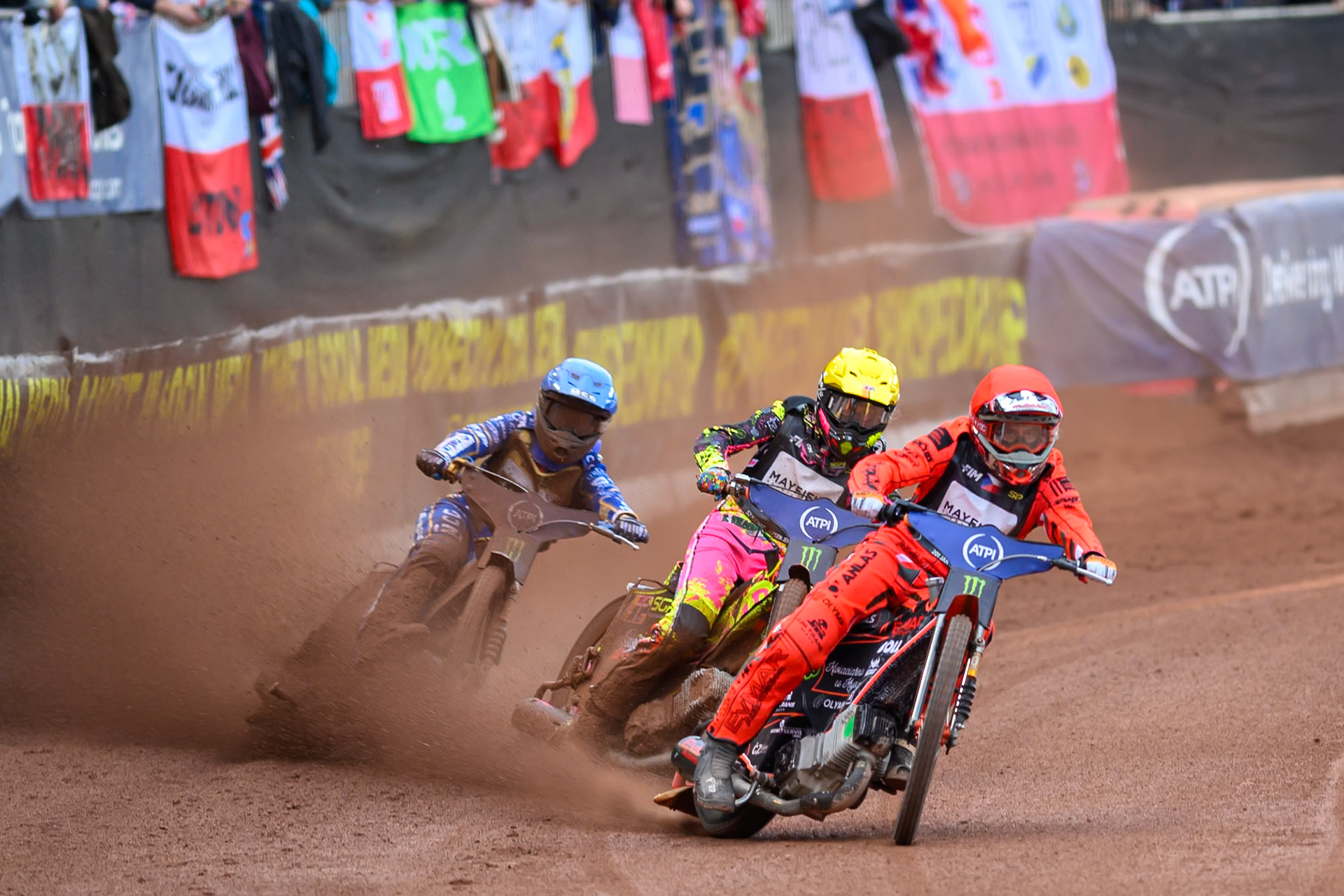 Jan Kvech (201) of Czech Republic in Red leading Michael Jepsen Jensen (52) of Denmark in Yellow and Bartosz Zmarzlik (95) of Poland in Blue during the ATPI  FIM Speedway GP of Manchester at the National Speedway Stadium, Manchester on Saturday 6th June 2026. (Photo: Ian Charles | MI News)