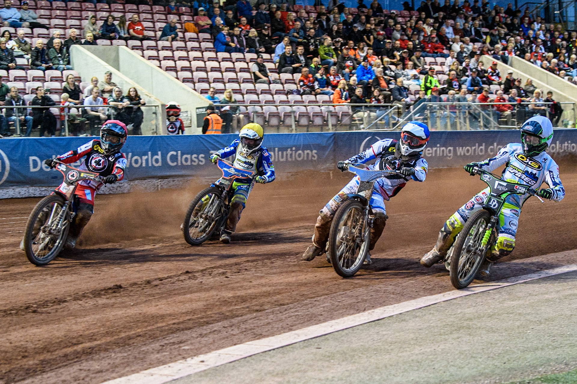 Oxford Spires' Charles Wright  in Yellow rides inside Belle Vue Aces' guest Antti Vuolas  in Blue, Oxford Spires' Luke Killeen  in Yellow and Belle Vue Aces' Ben Cook  in Red during the Rowe Motor Oil Premiership match between Belle Vue Aces and Oxford Spires at the National Speedway Stadium, Manchester on Monday 22nd July 2024. (Photo: Ian Charles | MI News)