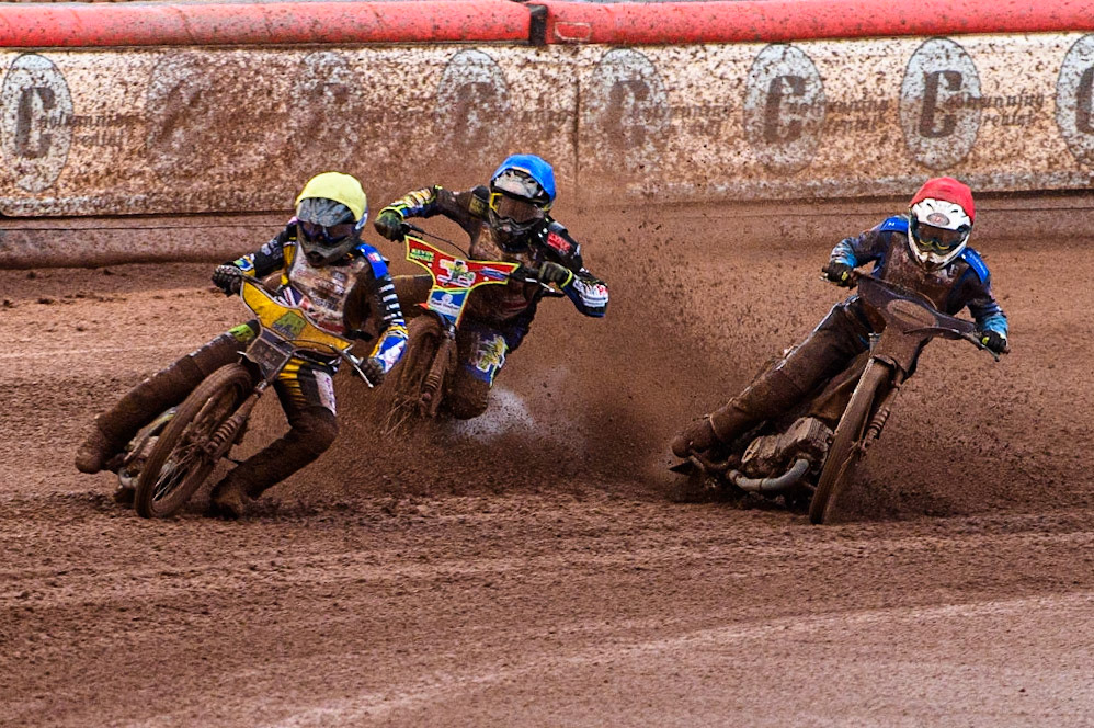 Ben Barker (Yellow) leads as Richard Lawson (Red) and Simon Lambert (Blue) struggle on the heavy track during the Sports Insure British Speedway Final at the National Speedway Stadium, Manchester on Monday 14th August 2023. (Photo: Ian Charles | MI News)