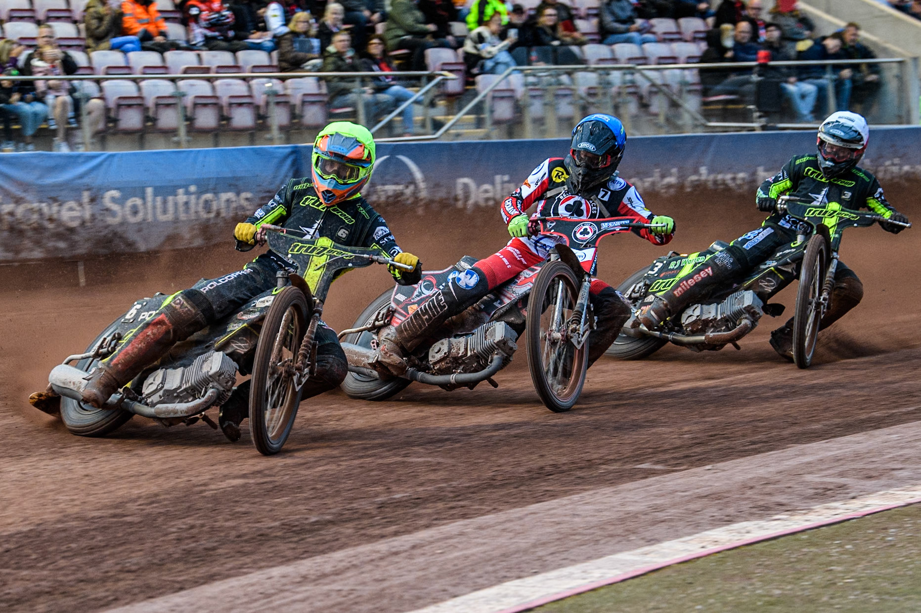 Ipswich Witches' Keynan Rew in Yellow leading Belle Vue Aces' Connor Bailey  in Blue and Ipswich Witches' Danny King in White during the Rowe Motor Oil Premiership match between Belle Vue Aces and Ipswich Witches at the National Speedway Stadium, Manchester on Monday 1st July 2024. (Photo: Ian Charles | MI News)