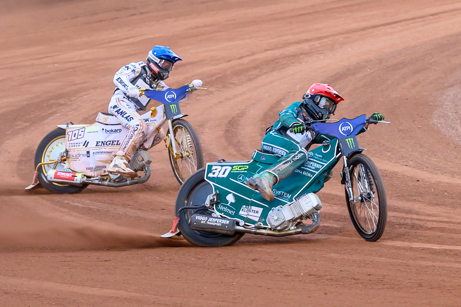 Leon Madsen (30) of Denmark in Red leading Anders Thomsen (105) of Denmark in Blue during the ATPI  FIM Speedway GP of Manchester at the National Speedway Stadium, Manchester on Friday 5th June 2026. (Photo: Ian Charles | MI News)