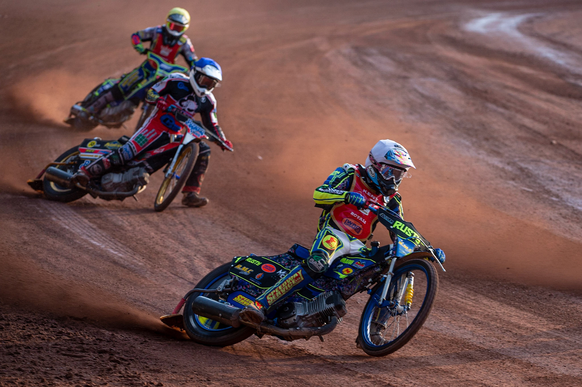 MANCHESTER, UK. JULY 2ND  Ryan Kinsley  (White) leads Paul Bowen  (Blue) and Jacob Clouting  (Yellow) during the National Development League match between Belle Vue Colts and Kent Royals at the National Speedway Stadium, Manchester on Friday 2nd July 2021. (Credit: Ian Charles | MI News)