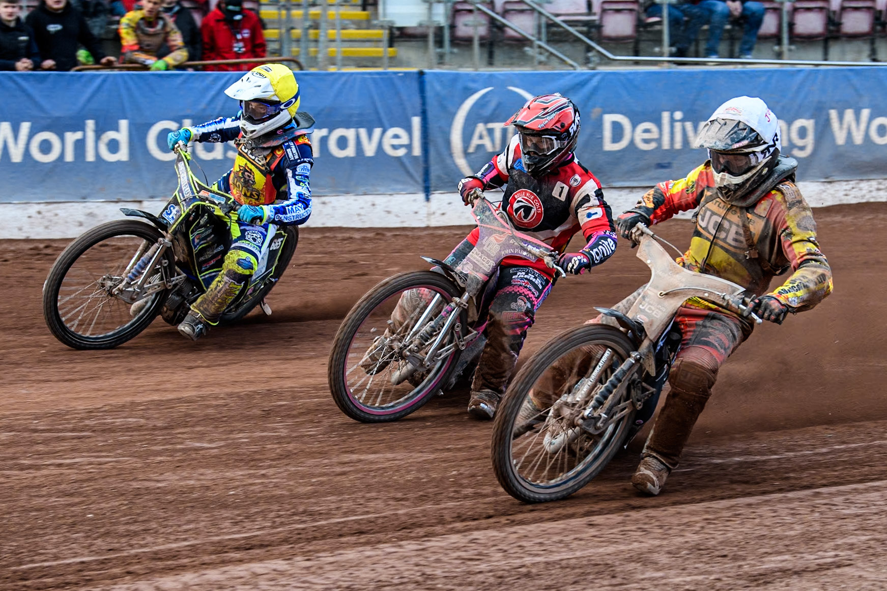 (L to R) Leicester Lion Cubs' Jody Scott (Yellow), Belle Vue Colts' Ben Trigger  (Red) and Leicester Lion Cubs' Joe Thompson (White) during the WSRA National Development League match between Belle Vue Colts and Leicester Lion Cubs at the National Speedway Stadium, Manchester on Friday 29th March 2024. (Photo: Ian Charles | MI News)