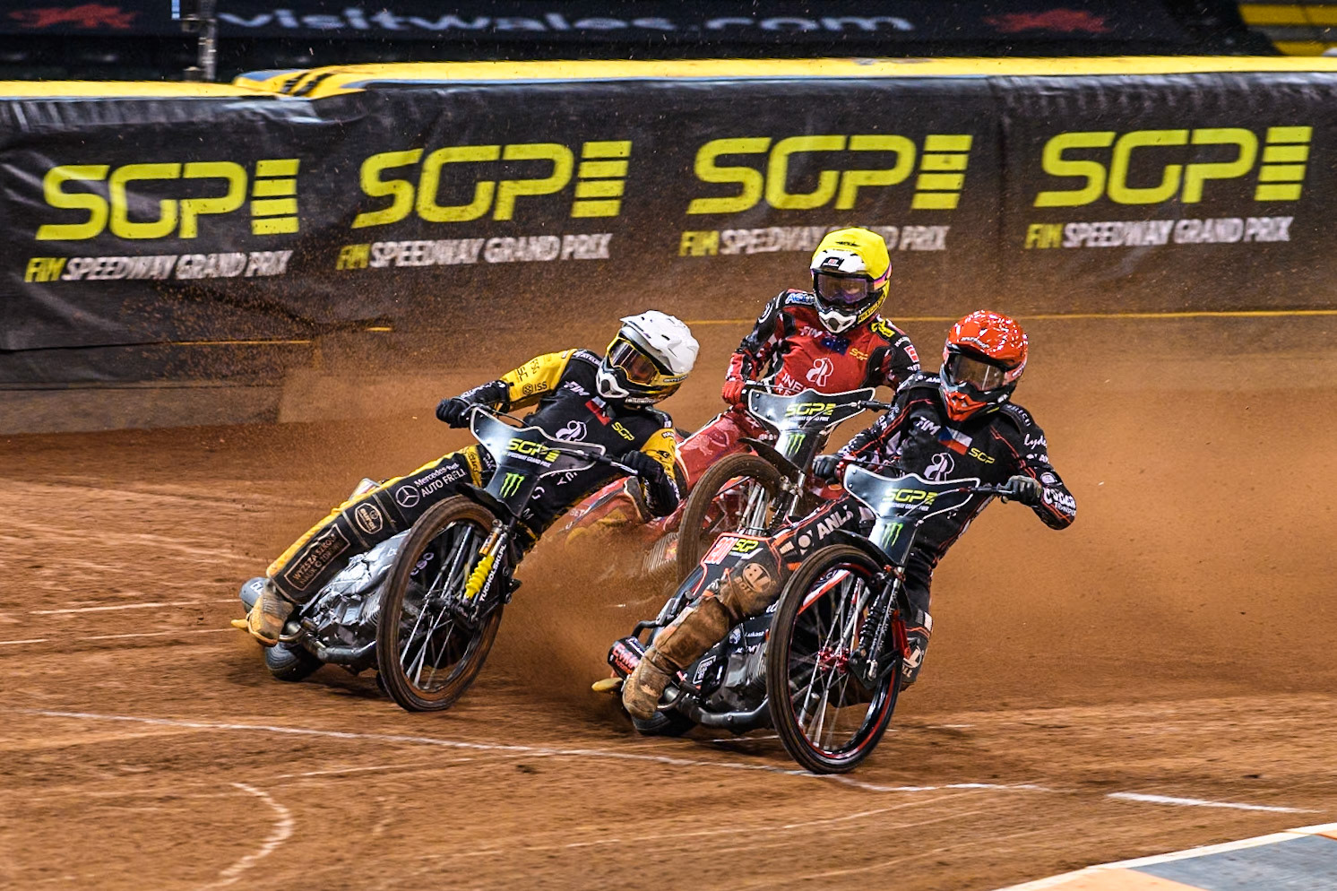 during the FIM Speedway Grand Prix of Great Britain at The Principality Stadium, Cardiff on Saturday 17th August 2024. (Photo: Ian Charles | MI News)January Kvech (201) of Czechia in Red rides inside Szymon Woźniak (48) of Poland in White with Max Fricke (46) of Australia in Yellow behind