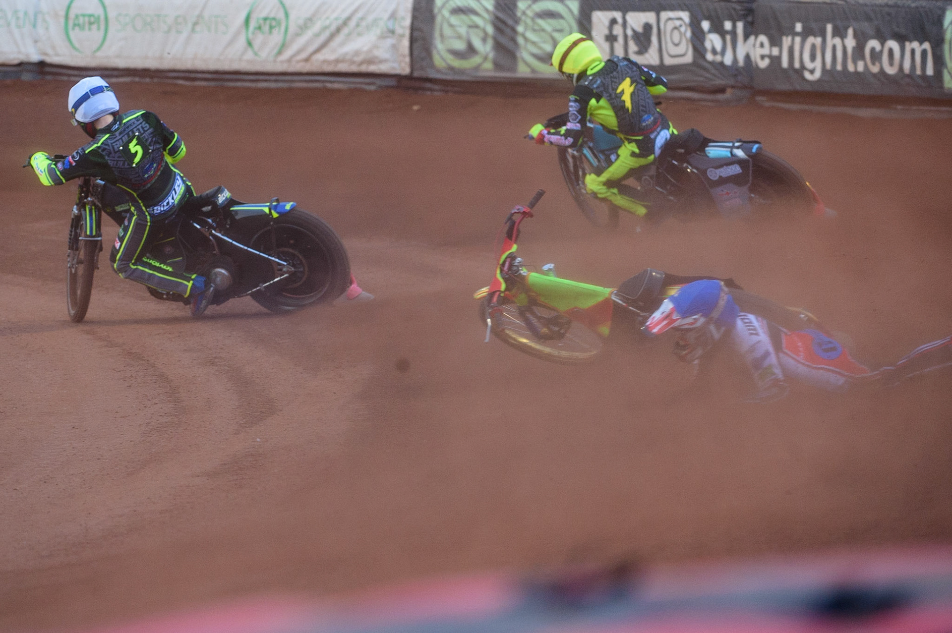 MANCHESTER, UK. MAY 28TH  Ben Woodhull  falls behind Kyle Bickley (White) and Jack Parkinson-Blackburn  (Red) during the SGB National Development League match between Belle Vue Colts and Berwick Bullets at the National Speedway Stadium, Manchester on Friday 28th May 2021. (Credit: Ian Charles | MI News)