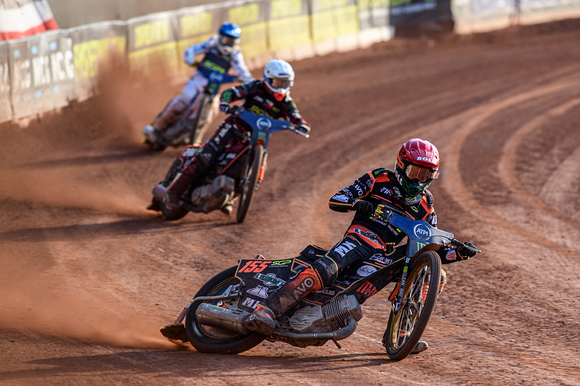 Mikkel Michelsen (155) of Denmark in Red leading January Kvech (201) of Czech Republic in White and Anders Thomsen (105) of Denmark in Blue during the ATPI FIM Speedway Grand Prix Round 5 at the National Speedway Stadium, Manchester, on Saturday 14th June 2025. (Photo: Ian Charles | MI News)